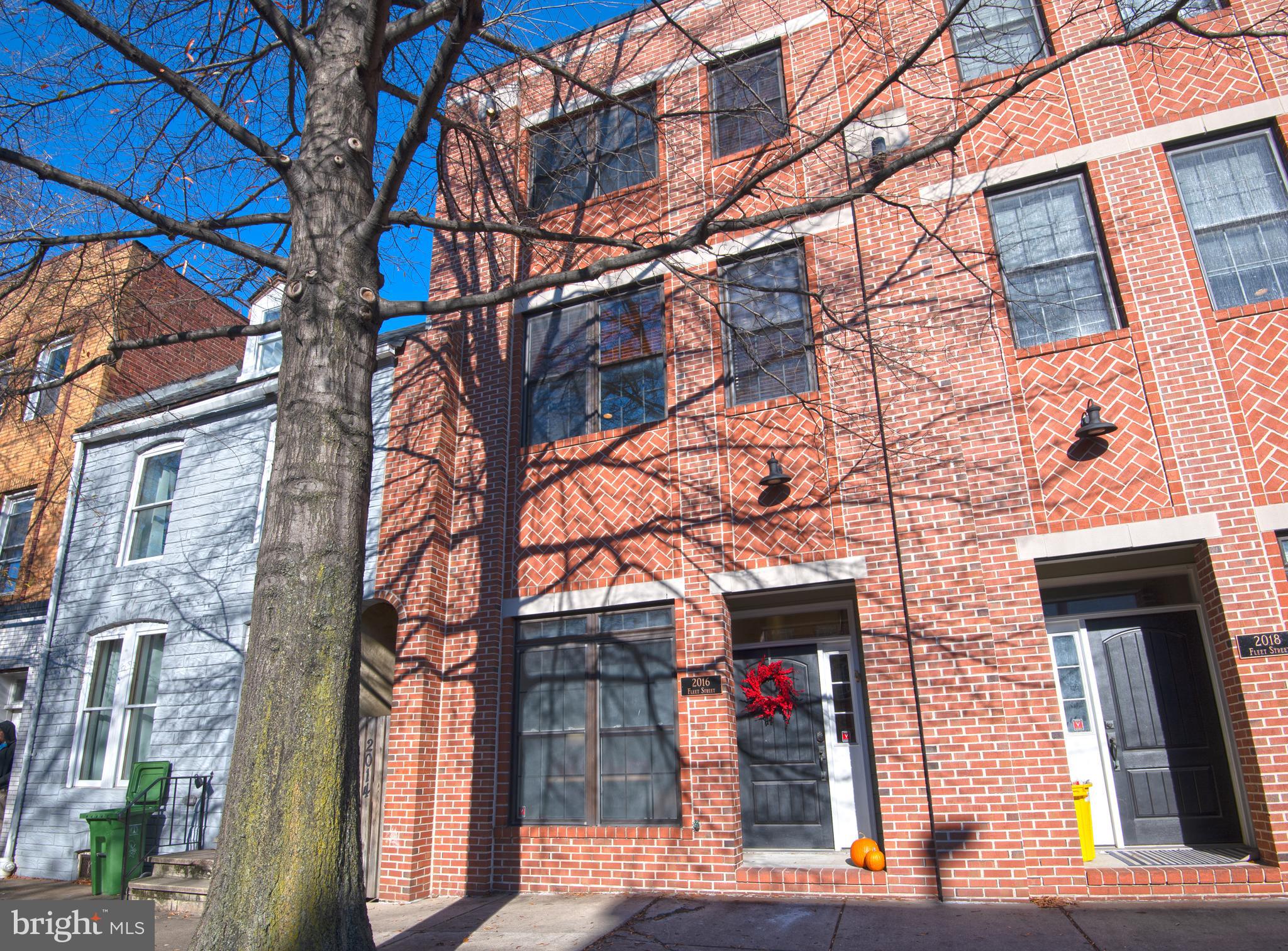 So much to love about this GARAGE townhome nestled right between Fells Point and Canton, and convenient to everything! Light filled and WIDE with three generously sized bedrooms. Owners have made loads of upgrades since purchasing in 2015.   They've added a half bath on the ground level and renovated all other bathrooms. Check out the spa-like master bath! Neutral paint throughout. Kitchen cabinets refinished in white, and brand new carpeting installed prior to listing. Garage painted and re-floored. New fixtures throughout, etc. etc.  There's an extra parking space outside the garage. Water and city views for days from the gorgeous rooftop. And it's a totally SMART house, including security system, camera, door locking and HVAC all controlled right from your phone. Small HOA fee takes care of snow removal, power washing and minor exterior maintenance. Walk to countless restaurants, cafes, supermarkets and more from your perfectly located home sweet home!