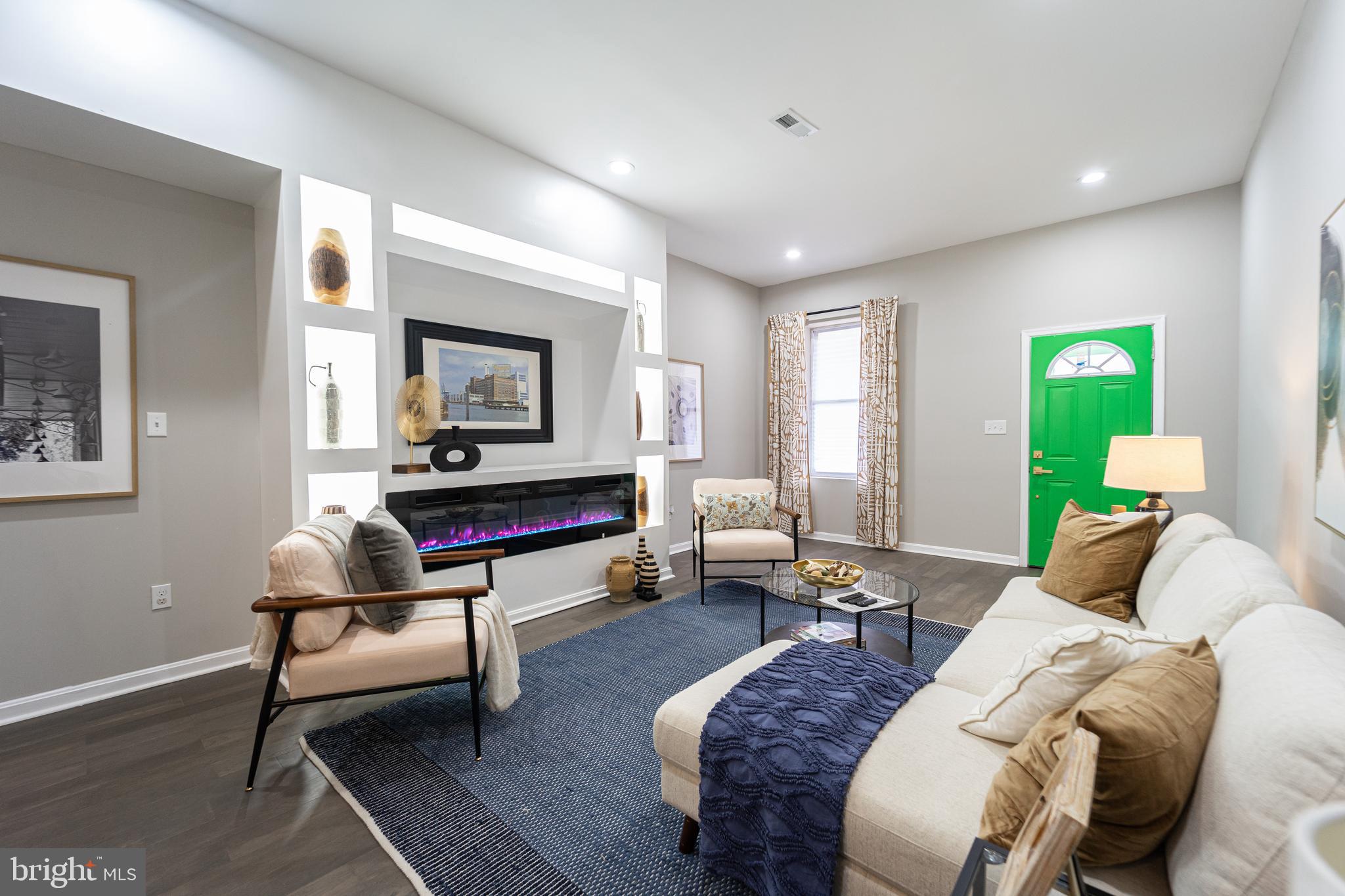 MOTIVATED SELLER!!! Step into a world of sophistication and comfort with this stunning 4-bedroom, 4-full bath, and 2 half-bath home. Nestled just minutes from downtown, the YMCA, the University of Maryland Medical Center, Penn Station, and both Subway and Light Rail Systems, this residence combines elegance with exceptional convenience. This beautifully renovated home features two grand 72-inch fireplaces—one on the main level and one in the basement—creating a warm and inviting atmosphere throughout. As you enter, you're greeted by a sunlit living room with soaring ceilings and a striking fireplace, complemented by recessed lighting that adds a touch of modern sophistication. The formal dining room is perfect for entertaining, boasting gorgeous hardwood floors, a second fireplace, and elegant chair railing. The gourmet kitchen is a chef's dream, featuring stainless steel appliances, a massive island, gold accent pendant lights, and sleek granite countertops. Retreat to the upper levels where four spacious bedrooms offer plush carpeting, large ceiling fans, and ample closet space. The convenience of an upper-level washer and dryer enhances the home's functionality. The finished basement, with its high ceilings, is ideal for family gatherings and entertaining. Outside, enjoy the tranquility of a secured, enclosed rear yard, offering peace of mind for your vehicle or just a private space to relax. Additionally, take advantage of a variety of grants and assistance programs, including the $10K Vacant to Value Grant, $10K CDBG Grant, $8750 Borrow Smart Program, $7.5K Go Northwest Grant, 3% Truist Bank Grant, and $5K Buying into Baltimore Grant. Plus, the seller is offering a 1-year home warranty for added peace of mind. Welcome to your new sanctuary in the heart of the Druid Heights Community!