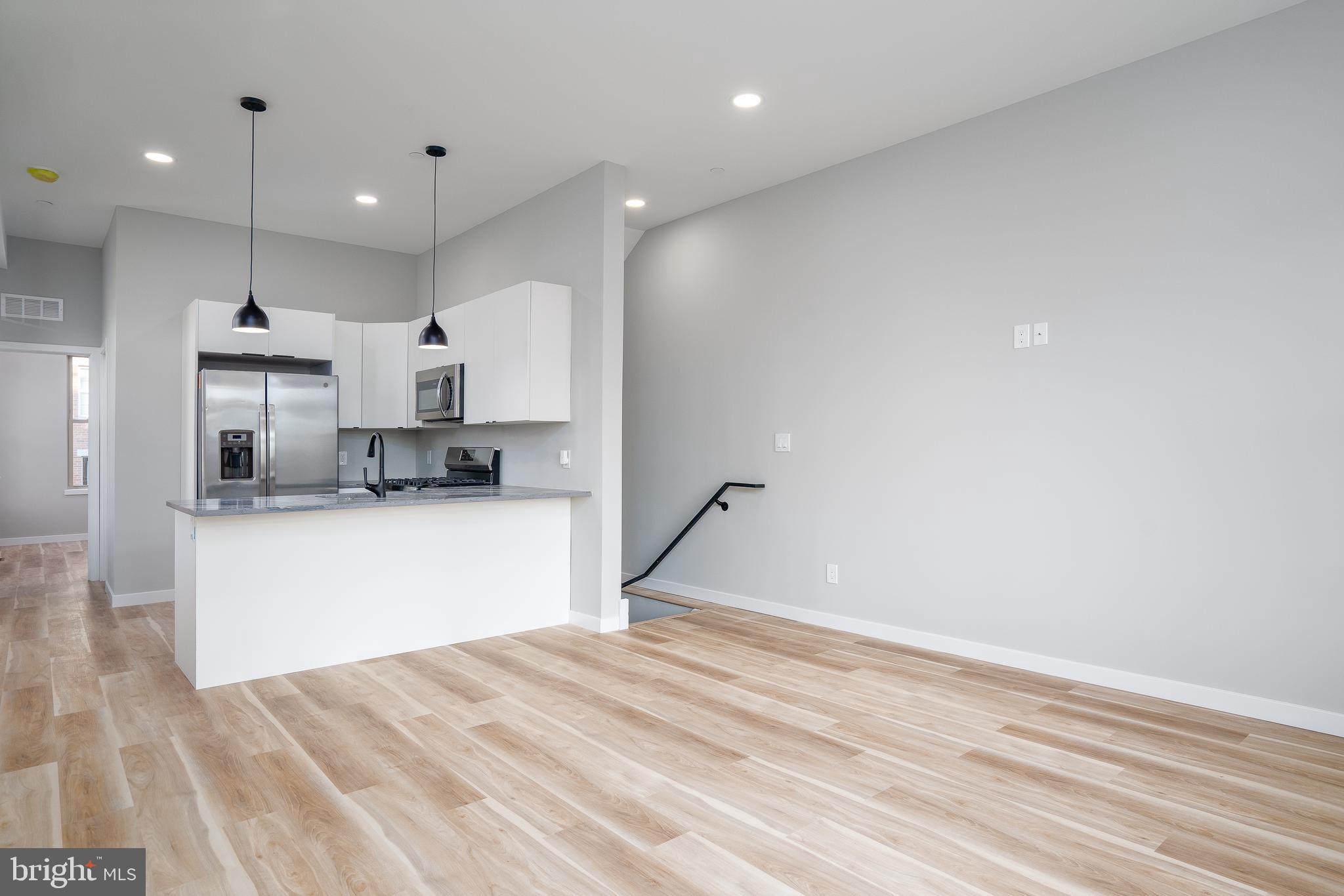 Welcome home to your brand new, corner apartment in Grays Ferry. Step inside to an open living space, flooded with natural light from every angle. The u-shaped kitchen is perfect for culinary enthusiasts, featuring gas range with white shaker cabinets, stainless steel appliances and granite countertops. With three spacious bedrooms and three full bathrooms, this apartment offers 1400 square feet of living space. Enjoy the glass slider onto the back patio, perfect for hosting gatherings or simply unwinding after a long day.  Additionally, a video doorbell ensures the utmost security and convenience. The washer and dryer is conveniently located within the unit, adding to the ease and convenience of everyday living. Don't miss out on the opportunity to call this beautiful apartment home. Just over a mile to the University of Penn, Rittenhouse and East Passyunk Square. Come take a look before it’s too late!