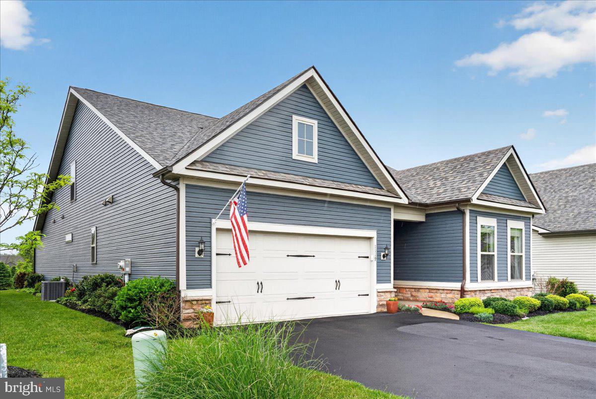 Welcome to the highly sought after active adult community of Del Webb North Penn, where luxury, comfort, and carefree living come together beautifully. Built just over three years ago, this exceptional single-family home offers sophisticated one-level living, premium upgrades, and thoughtfully designed spaces perfect for everyday living and entertaining.
This popular floorplan features 3 spacious bedrooms, 3 full baths; 1 powder room, and an open-concept layout filled with custom finishes and architectural detail. From the moment you enter, you’ll appreciate the upgraded molding, custom wainscoting, tray ceilings, designer lighting, ceiling fans, hardwood flooring, plantation shutters, and elegant touches throughout.
The gourmet chef’s kitchen serves as the heart of the home, showcasing upgraded quartz countertops, premium cabinetry, Whirlpool appliances including a gas cooktop with designer hood, a large center island with seating for four, and a sunny breakfast café area ideal for casual dining. The adjoining family room offers warmth and charm with custom built-in cabinetry and bookshelves surrounding the fireplace, while the formal dining area provides the perfect backdrop for holidays, celebrations, and gatherings with family and friends with its convenient access to the patio.
A versatile flex room featuring French doors, a glass transom, custom built-ins, and imported Murano, Italy chandeliers creates an ideal space for a home office, library, or sitting room. The luxurious primary suite offers tray ceilings, custom window treatments, dual walk-in closets, and a spa-inspired bath complete with dual vanities, oversized seated shower, private water closet, and refined finishes.
The home’s thoughtful layout provides wonderful flexibility for owners and guests alike, offering both inviting gathering spaces and private retreats. An additional ensuite bedroom on the main level is perfect for the out-of-town guest, while the spacious loft, second-floor bedroom, and additional full bath create an ideal private suite or extended living area. A full laundry room with upgraded cabinetry and granite utility sink adds everyday convenience.
Additional upgrades include an upgraded stair banister with carpet runner, designer chandeliers, wallpaper accents, custom blinds, additional electrical floor outlet, garage shelving, storm door with screen, and countless custom enhancements throughout. Lastly, the beautiful custom landscaping around the entire home offers exquisite curb appeal!
The private porch and patio area with an electric slider door, is the perfect spot for morning coffee, quiet evenings, or enjoying views of the beautifully landscaped surroundings and open green space beyond. Professionally maintained grounds, additional planting beds, and scenic community spaces enhance the home’s peaceful setting.
Residents of Del Webb North Penn enjoy an exceptional lifestyle with resort-style amenities including a stunning clubhouse, fitness center, pool, tennis and pickleball courts, walking paths, and an active social calendar tailored to every comfort level. Lawn maintenance, snow removal, and exterior community care are all included, allowing for truly low-maintenance living. Conveniently located near shopping, dining, parks, golf courses, churches, and everyday conveniences, this welcoming community offers both privacy and connection.
Warm, elegant, and beautifully appointed, this remarkable home has been a wonderful place to gather, entertain, celebrate, and create lasting memories offering comfort, beauty, and a true sense of home for its next owner.