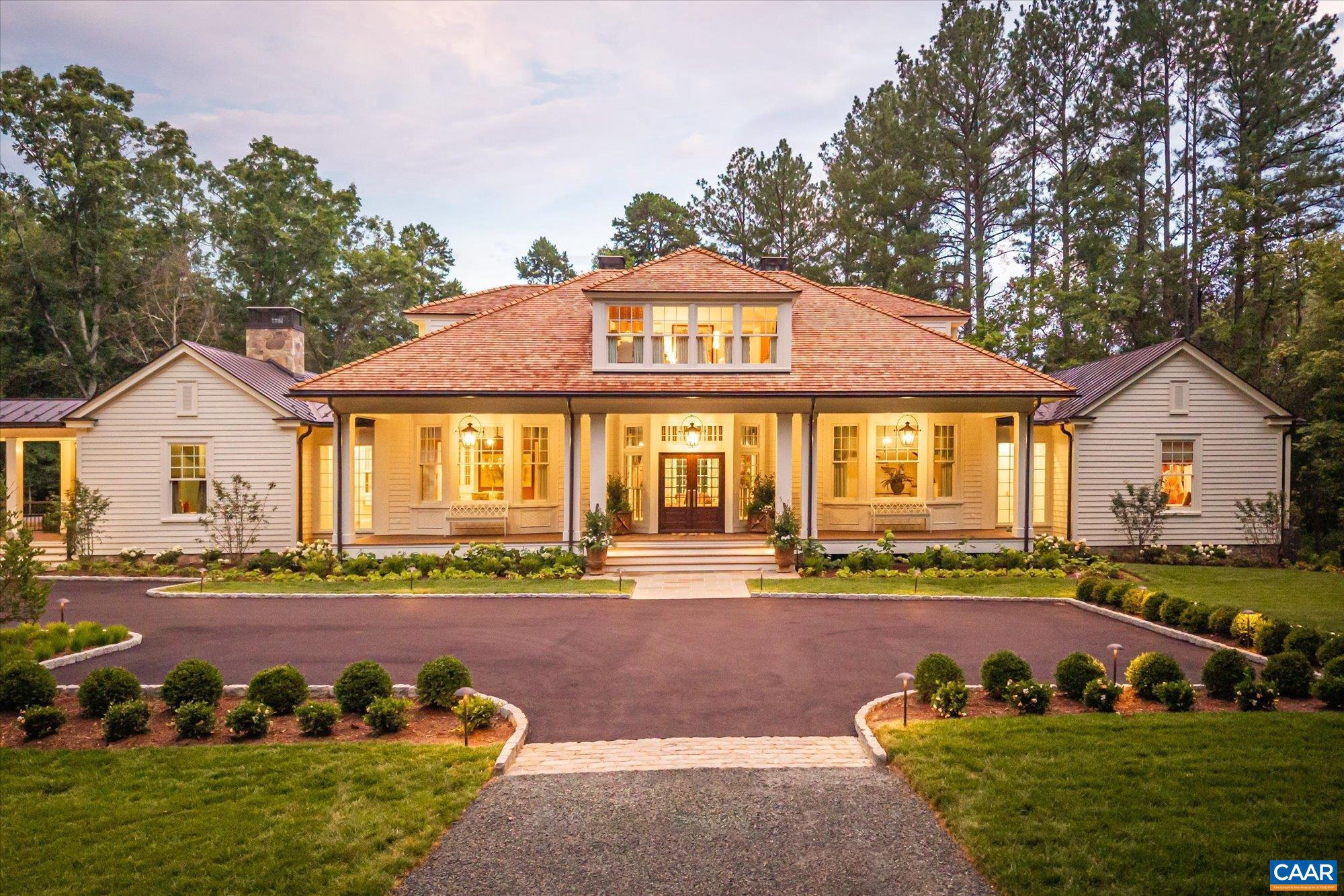 Keswick Springs | Set on five acres blending manicured gardens with natural beauty in Keswick Estate just outside Charlottesville, this 4,900+ sq ft home offers 4 bedrooms and 4 full-plus-2 half baths, combining traditional Southern architecture with modern livability.  Light-filled interiors include a refined dining room, library, chef?s kitchen with scullery and wet bar, and multiple spaces for entertaining. The primary suite is a private retreat, while additional bedrooms and a snug studio offer flexibility for guests or work. Custom wallpaper, artisan-crafted millwork, and expansive windows frame garden and water views.  Outdoor living features deep porches, a screened porch, and terraces overlooking native plantings, kitchen gardens, fruit trees, and a tranquil lake.  Within Keswick Estate, owners have the option to join the Keswick Club, offering Pete Dye?s Full Cry championship golf course, an adults-only infinity-edge pool, tennis courts, fitness center, spa, and dining at Marigold by Jean-Georges. Enjoy a rare blend of timeless design, resort-style amenities, and a serene natural setting in one of Virginia?s most prestigious communities.,Exterior Fireplace,Fireplace in Living Room