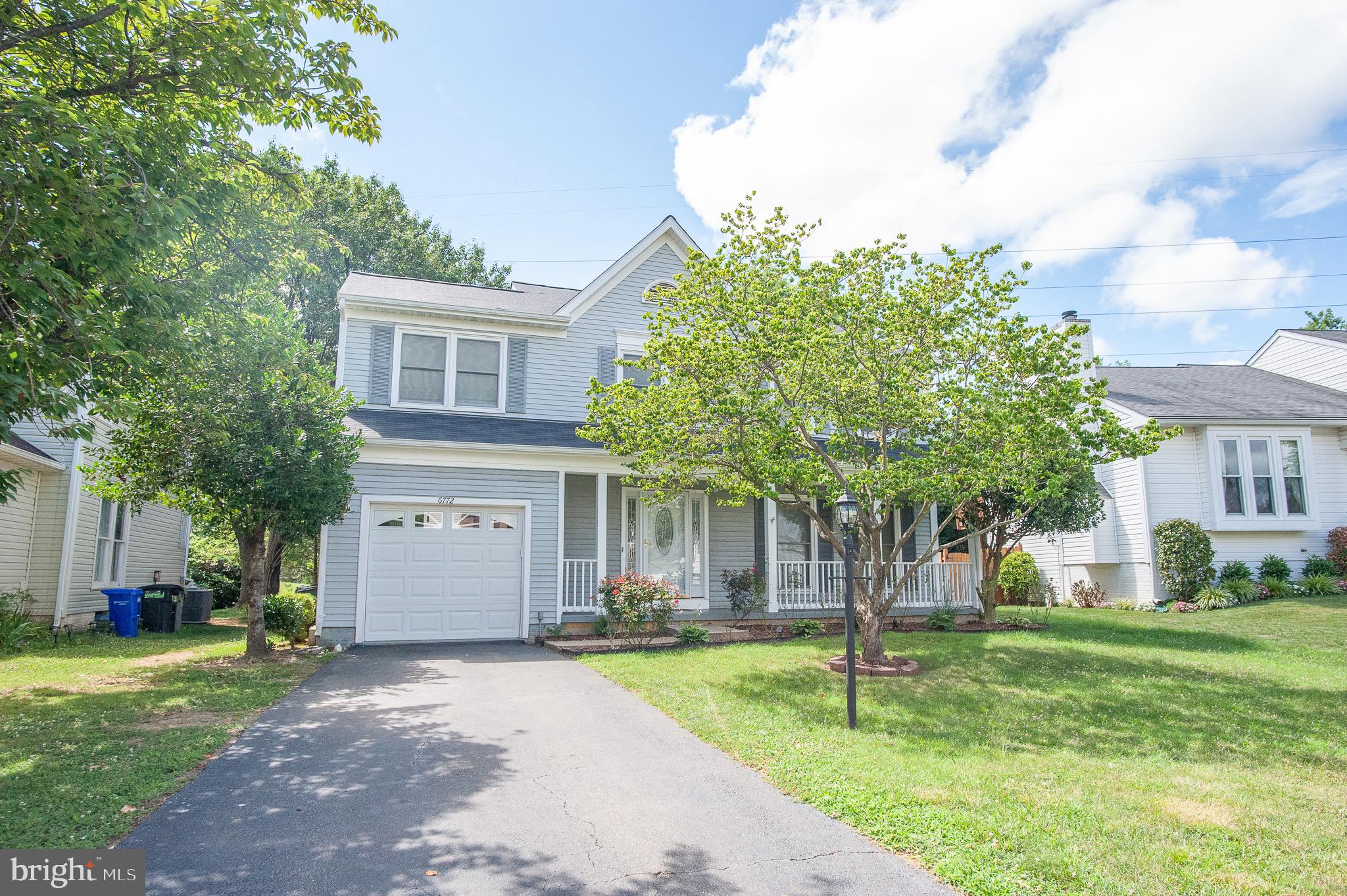 Welcome to 6772 Morning Ride Circle. Walk to the pool, playground and sports courts from this wonderful 5 bedroom, 3.5 bath single family home in Alexandria’s always popular Landsdowne! This Emerson model has almost 3,000 square feet of living space and features gleaming hardwood floors in the foyer, hallway, living and dining rooms. The eat-in kitchen has newer stainless appliances and ceramic tile flooring and the adjacent family room boasts a brick fireplace, cathedral ceiling with 2 skylights and French doors leading out to the large wrap-around deck and backyard. The cheery living room with two windows flows into a separate dining room that has a bay window that brings in lots of natural light. Upstairs the owner’s suite includes a vaulted ceiling with a fan, walk-in closet and a deluxe bath with a dual sink vanity, separate soaking tub and shower. Three other spacious bedrooms share the hall bath with ceramic tile flooring. The lower level features the 3rd full bath, fifth bedroom and the terrific rec room with a wet bar, plenty of storage space and walk-out stairs to the backyard. Landsdowne is conveniently located across the street to the Hilltop Village Center with Wegmans, LA Fitness and an assortment of dining choices. Also close by are Fort Belvoir, Metro, all major commuter routes, Island Creek Elementary School and multiple town centers!