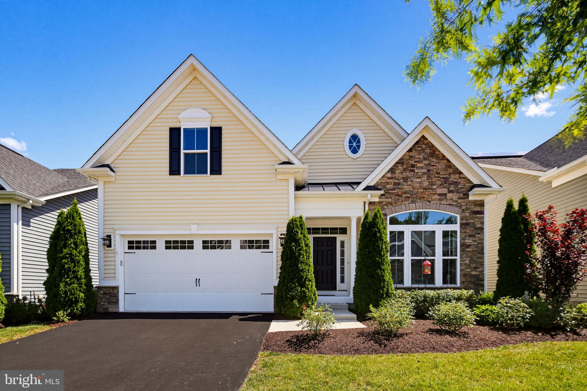 Experience low-maintenance luxury living in this stunning 3-bedroom, 2-bath detached home in the highly sought-after 55+ Regency at Two Rivers. Built in 2018, the home showcases a bright, open floorplan with 10' ceilings and an inviting entry foyer. The family room impresses with a coffered ceiling, gas fireplace, and custom built-in bookcases, flowing seamlessly into a fabulous gourmet kitchen with a large center island, abundant counter space, a gas cooktop, stainless steel appliances, and a walk-in pantry. The main-level primary suite features a tray ceiling, a spa-like bath with upgraded tile in the walk-in shower, dual vanities, and a generous walk-in closet. A spacious secondary bedroom with an attached full bath provides ideal guest accommodations, while French doors open to a versatile study that can serve as a third bedroom. Everyday convenience shines with a two-car garage leading into a spacious mudroom and a main-level laundry. Enjoy outdoor living on the deck with an adjoining patio. Upstairs, a flexible bonus room offers the perfect spot for a cozy sitting area, hobby space, or additional guest room. The expansive lower level is unfinished but enormous, presenting a blank slate for a media room, gym, workshop, or extra storage. Set within the active adult enclave of Regency at Two Rivers—nestled inside the larger, non-age-restricted Two Rivers community—residents enjoy a vibrant clubhouse, fitness center, indoor and outdoor pools, and a robust schedule of activities for all ages. This is an exceptional home combining style, function, and an unbeatable lifestyle—don’t miss it.
