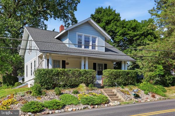 Nestled in highly desired Lower Saucon Township, this beautifully refreshed 1940 Cape Cod blends classic charm and character with unexpected spaciousness, offering 1,638 square feet of updated living area on a lush quarter-acre lot. Priced well below the area's median price point, this home is an absolute dream for growing families looking to plant roots in the top-tier Saucon Valley School District. From the moment you arrive, you will fall in love with its quaint, timeless curb appeal. A welcoming walkway, lined with mature trees that provide exceptional peace and privacy, guides you straight to the covered front porch. Step inside to the true heart of the home: a large, inviting eat-in kitchen that flows effortlessly into a sunny dining area and cozy living room setup. This highly versatile floor plan features 3 to 4 bedrooms, highlighted by a main-floor bedroom and attached study for ultimate convenience. At the center of the main level sits a beautifully renovated half-bath addition. Heading upstairs, you will find a completely renovated full bathroom alongside plenty of bonus rooms that can be tailored to fit your exact lifestyle. This upper level includes a bedroom with a fantastic walk-in closet, a sprawling primary bedroom that leads right into a huge bonus hobby room, and an extra-bright space that makes a perfect home office, playroom, or storage haven. Outside, the property is a dream for anyone who loves weekend projects or needs extra storage, boasting a generous yard with a handy shed, a huge parking pad, and a massive two-car garage complete with a dedicated workshop and newly rebuilt lofted framing. It is the perfect blend of a quiet, old-school neighborhood feel that is still just minutes from major highways, giving you a peaceful retreat that never sacrifices convenience. Showings begin Saturday 6/27.