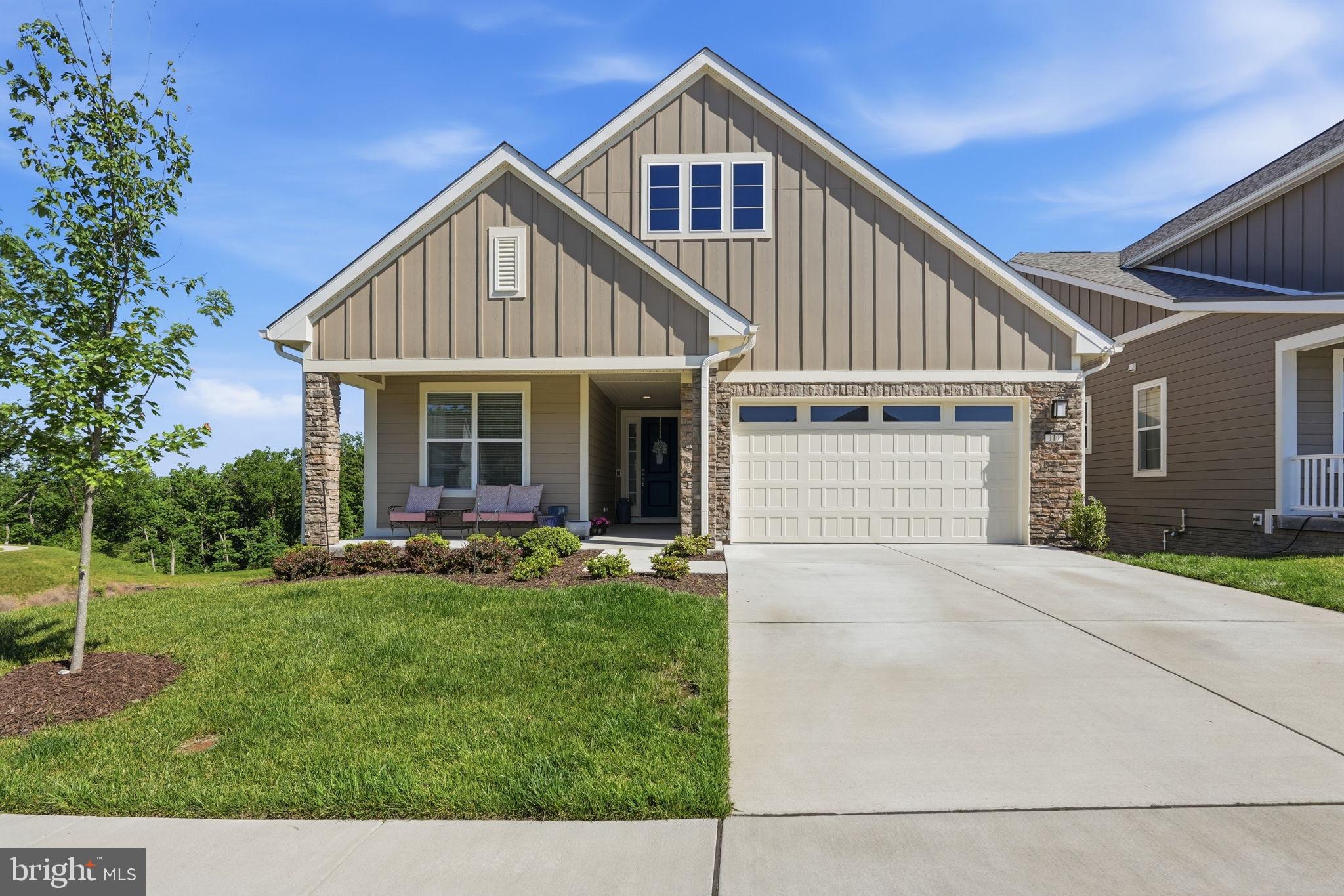 Experience exceptional active adult living in Trilogy at Lake Frederick, the area's premier 55+ community where resort-inspired amenities and thoughtfully designed homes create a lifestyle you'll love. Built in 2024 and beautifully maintained, this like-new residence offers over 3,400 square feet of thoughtfully designed living space with three bedrooms, three full bathrooms, and a finished walkout lower level designed for both comfort and entertaining.
<br><br>
The open-concept main level creates an inviting atmosphere where living, dining, and kitchen spaces flow seamlessly together, ideal for both everyday living and hosting family and friends. Engineered wood flooring extends throughout the entire main level, adding warmth and continuity to the living spaces. At the center of the home, the beautifully appointed kitchen showcases upgraded KitchenAid stainless steel appliances, Shea Homes' Signature Kitchen layout, generous prep space, and a large walk-in pantry providing exceptional storage and organization.
<br><br>
The spacious main-level primary suite offers comfort and privacy, while upgraded tile selections throughout all bathrooms and the laundry room add a refined designer touch. Expansive windows and multi-slide doors fill the home with natural light while creating a seamless indoor-outdoor connection.
<br><br>
Step outside to enjoy peaceful rear deck views and an outdoor living space designed for year-round enjoyment. The back deck fireplace creates the perfect setting for morning coffee, quiet evenings, or gathering with guests while overlooking the surrounding scenery.
<br><br>
The finished walkout lower level significantly expands the home's versatility, featuring a large open recreation room with abundant space for entertaining, hobbies, fitness, media enjoyment, or additional gathering areas, along with a full bathroom and flexible bonus space.
<br><br>
Life at Trilogy at Lake Frederick extends far beyond your front door. Residents enjoy an impressive collection of amenities including indoor and outdoor pools, a state-of-the-art fitness center, tennis and pickleball courts, scenic walking trails, a dog park, and the expansive Shenandoah Lodge featuring Region's 117 farm-to-table restaurant, a private members lounge, arts and crafts spaces, social events, and countless opportunities to connect with neighbors and friends.  Discover the perfect combination of luxury, comfort, and low-maintenance living in one of the region's most sought-after active adult communities.