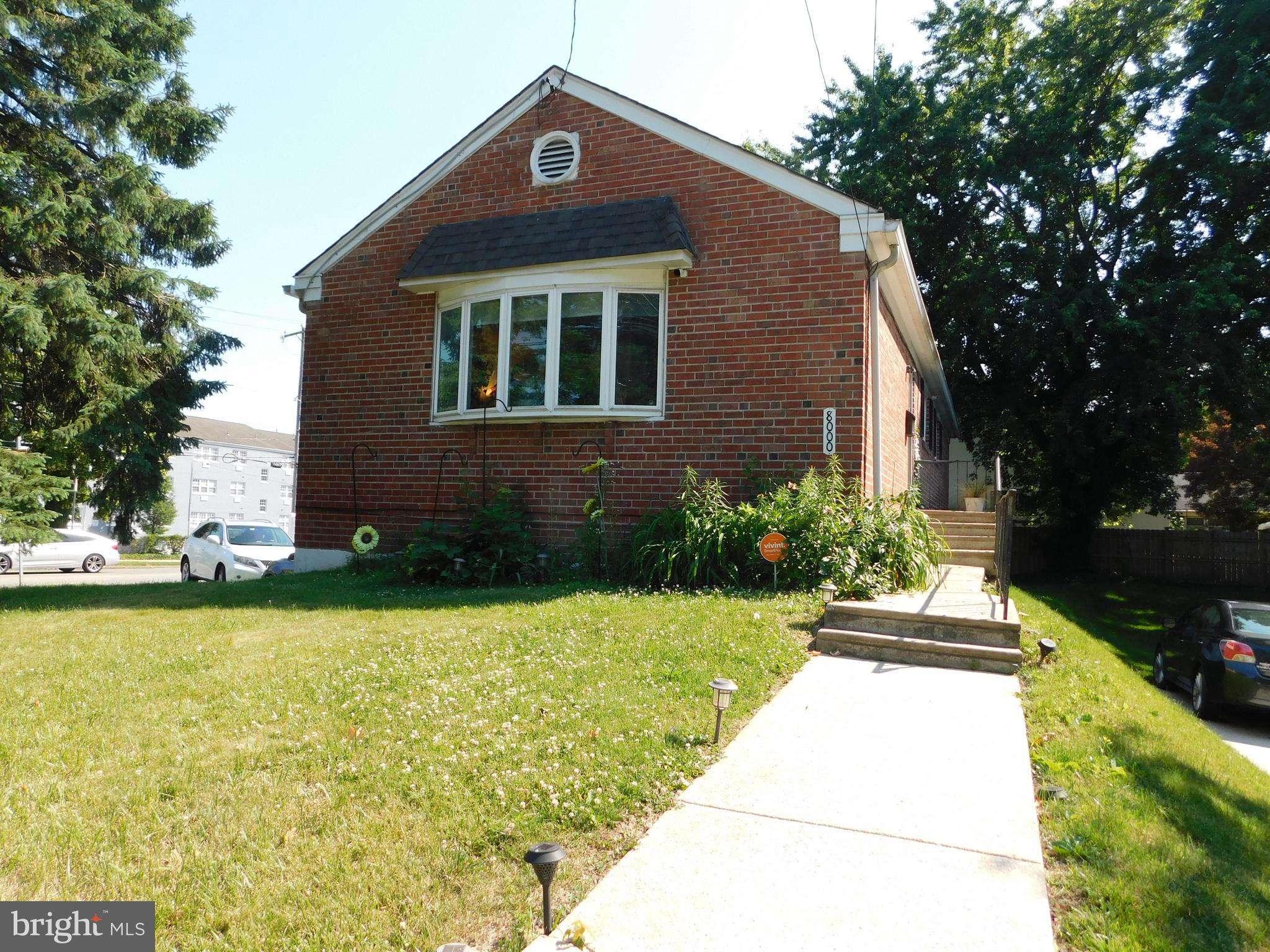 This Beautiful corner lot property is located in Chestnut Hill at 8000 Stenton Avenue! This home is a rancher with a basement and a very large 2 car garage with enough room for 2 cars in the driveway. The privately fenced back yard is great for summer barbecues or just relaxing under the shade tree. Enter the finished extra-large basement from the garage or driveway, and from the back yard Sliders. Upon entering the main level, you will see sprawling hardwood floors that flow through a spacious living room and dining room. The Living room has a large bay window adorning the room with plenty of natural light. The Dining room has an east-facing window allowing the morning sunlight in. There is an eat-in kitchen with plenty of seating space. There are three bedrooms on the main level with a primary bedroom ensuite with a walk-in shower. Also, an additional full bath just off the hallway leading to the bedrooms. The kitchen stairwell leads to the finished basement with a Half bath, laundry area, and additional storage areas.  All Appliances are as-is, as seen. This home is priced to sell and priced well below Market value.  Similar nearby homes in the area have sold for well over $600,000.  This is your opportunity to have a Chestnut Hill address at a bargain. Ideally located with easy access to regional rail, the Wissahickon trails, and neighborhood gems like Woodmere Art Museum and Morris Arboretum. Also, just moments from Chestnut Hill’s vibrant shops, and restaurants.  This home is a must see!