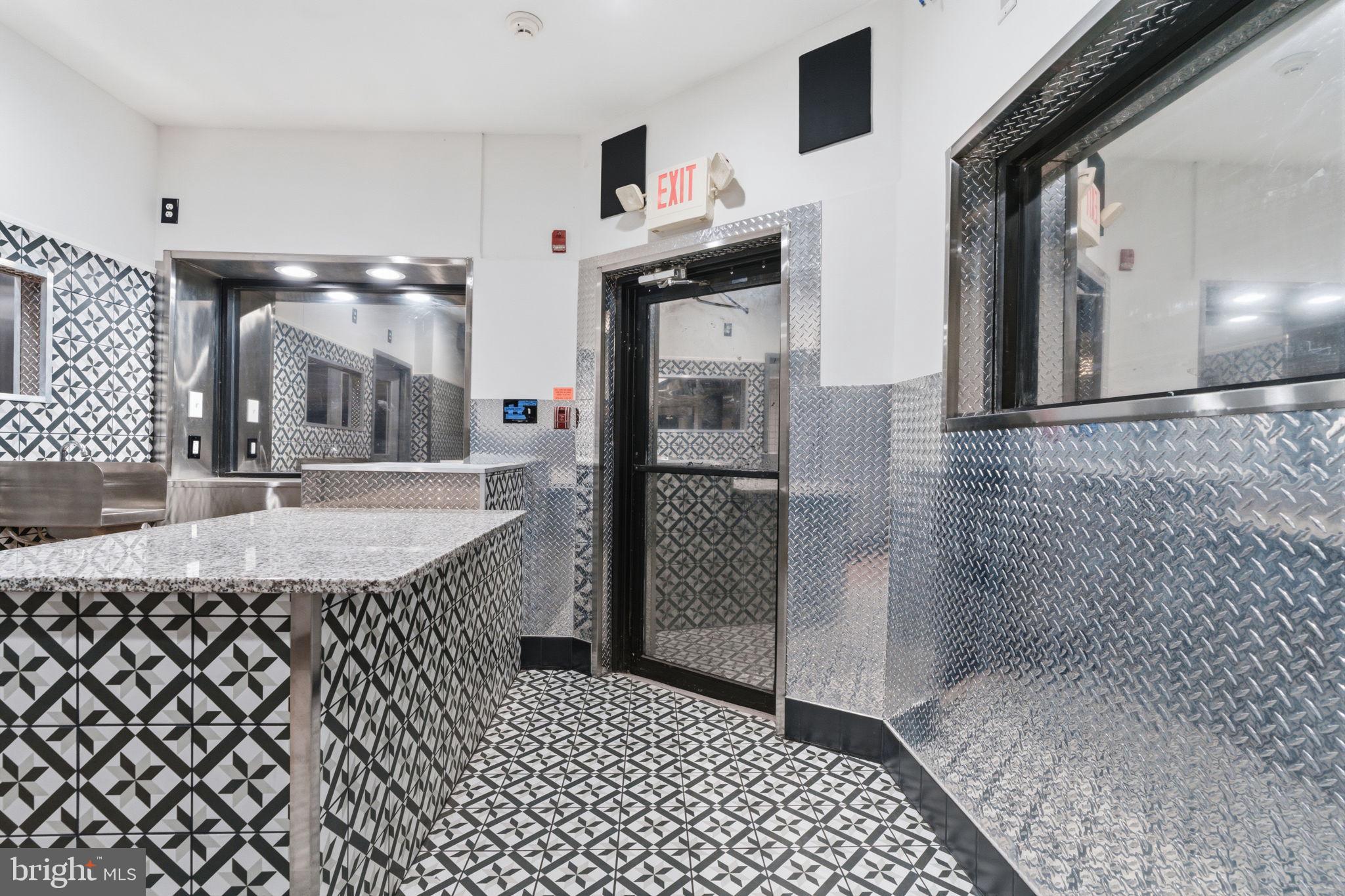 Prime commercial opportunity at 2956 N 2nd St, Philadelphia, PA! This newly renovated property is move-in ready and perfectly suited for a restaurant, takeout spot, or ghost kitchen. The previous owner fully transformed the interior into a modern pizzeria/cheesesteak shop, with all work completed to code and in pristine condition. The layout features a welcoming front pickup and ordering area, leading to a spotless, fully updated stainless steel kitchen in the rear designed for efficiency and high-volume operation. A convenient side door and pickup window make it ideal for delivery services like DoorDash, Uber Eats, and Grubhub. Major upgrades include a new water heater, HVAC system, plumbing, and roof—offering peace of mind for years to come. Positioned on the busy corner of 2nd and Indiana, the property benefits from strong visibility and foot traffic, with a 50-unit senior living building directly across the street providing a built-in customer base. Surrounded by the community and ready for immediate operation, this is a fantastic opportunity for any business owner looking to open shop—schedule your showing and make your offer today!