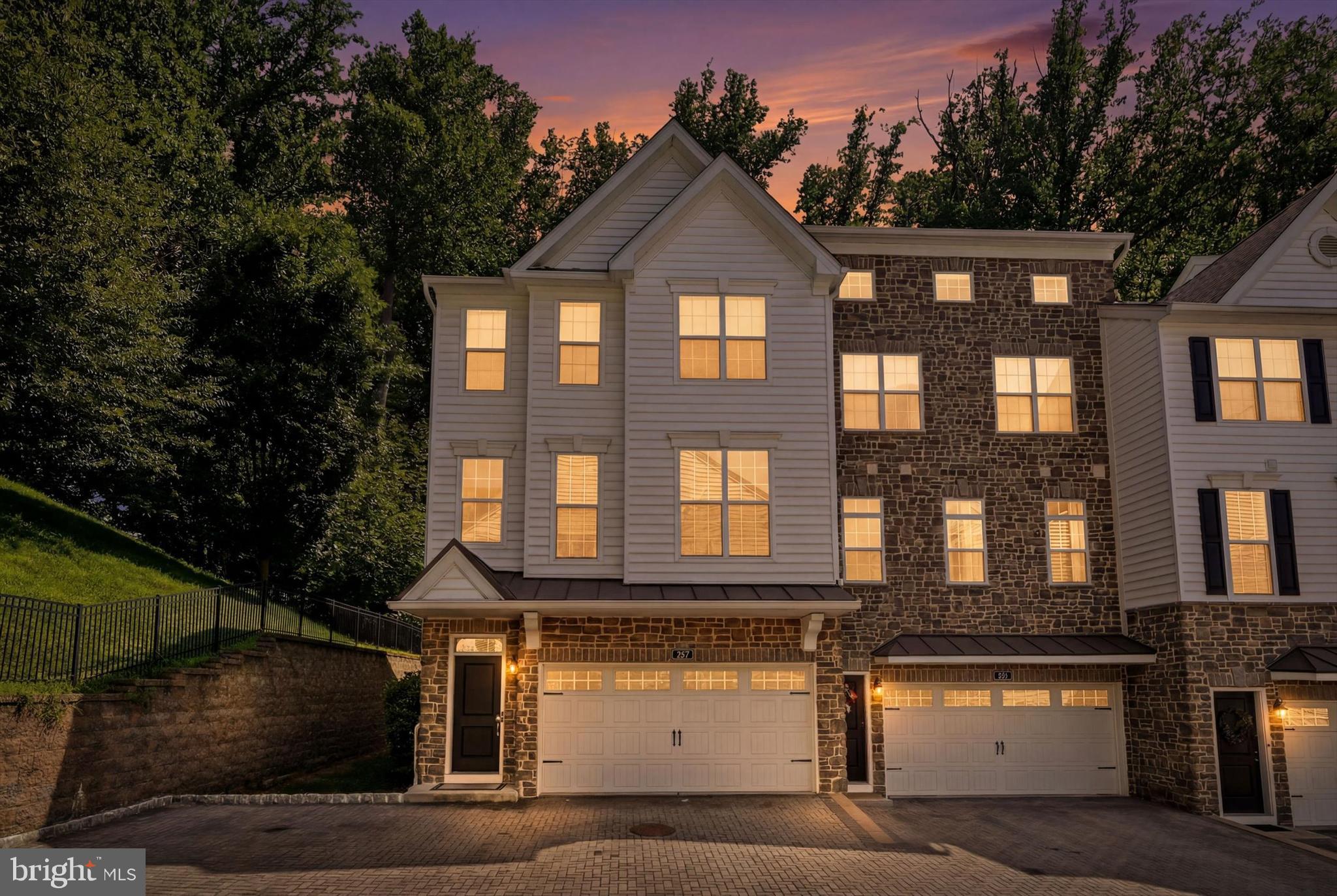 Welcome to 109 Eastwing Aly, a beautifully maintained end-unit townhome in the highly sought-after Ravenscliff community in Marple Township. Offering approximately 3,000 square feet of living space across three finished levels, this home combines modern finishes, an open layout, and a private wooded setting.

The entry level features a spacious foyer, convenient interior access to the oversized two-car garage, an expansive finished lower level with a powder room that provides endless possibilities as a family room, home office, fitness area, media room, or playroom. Sliding doors lead directly to the rear yard, while abundant storage space makes everyday living easy.

The main living level was designed for entertaining with 9-foot ceilings, hardwood floors, recessed lighting, and an open-concept floor plan. The gourmet kitchen features granite countertops, stainless steel appliances, a large center island with seating, abundant cabinetry, and a pantry. The kitchen flows seamlessly into the dining area and spacious great room, creating the perfect gathering space for family and friends. Just off the living area, step onto the oversized composite deck overlooking mature trees, offering exceptional privacy and a peaceful backdrop rarely found in townhouse communities.

The upper level includes three generously sized bedrooms, two full bathrooms, and a conveniently located laundry room. The spacious primary suite features a large walk-in closet and a luxurious en-suite bath with a double vanity, oversized glass-enclosed shower, and private water closet. Two additional bedrooms share a well-appointed hall bathroom with a tiled tub surround.

Additional highlights include an oversized two-car garage, second-floor laundry, ample storage throughout, and one of the community's most desirable locations backing to mature woods.

Ideally situated just minutes from Ellis Preserve, Whole Foods, restaurants, shopping, and major commuter routes including I-476, Route 3, and the Philadelphia International Airport, this exceptional home offers the perfect combination of convenience, comfort, and low-maintenance living.

Don't miss this opportunity to own one of Ravenscliff's premier end-unit homes with a private wooded setting. Schedule your private showing today!
