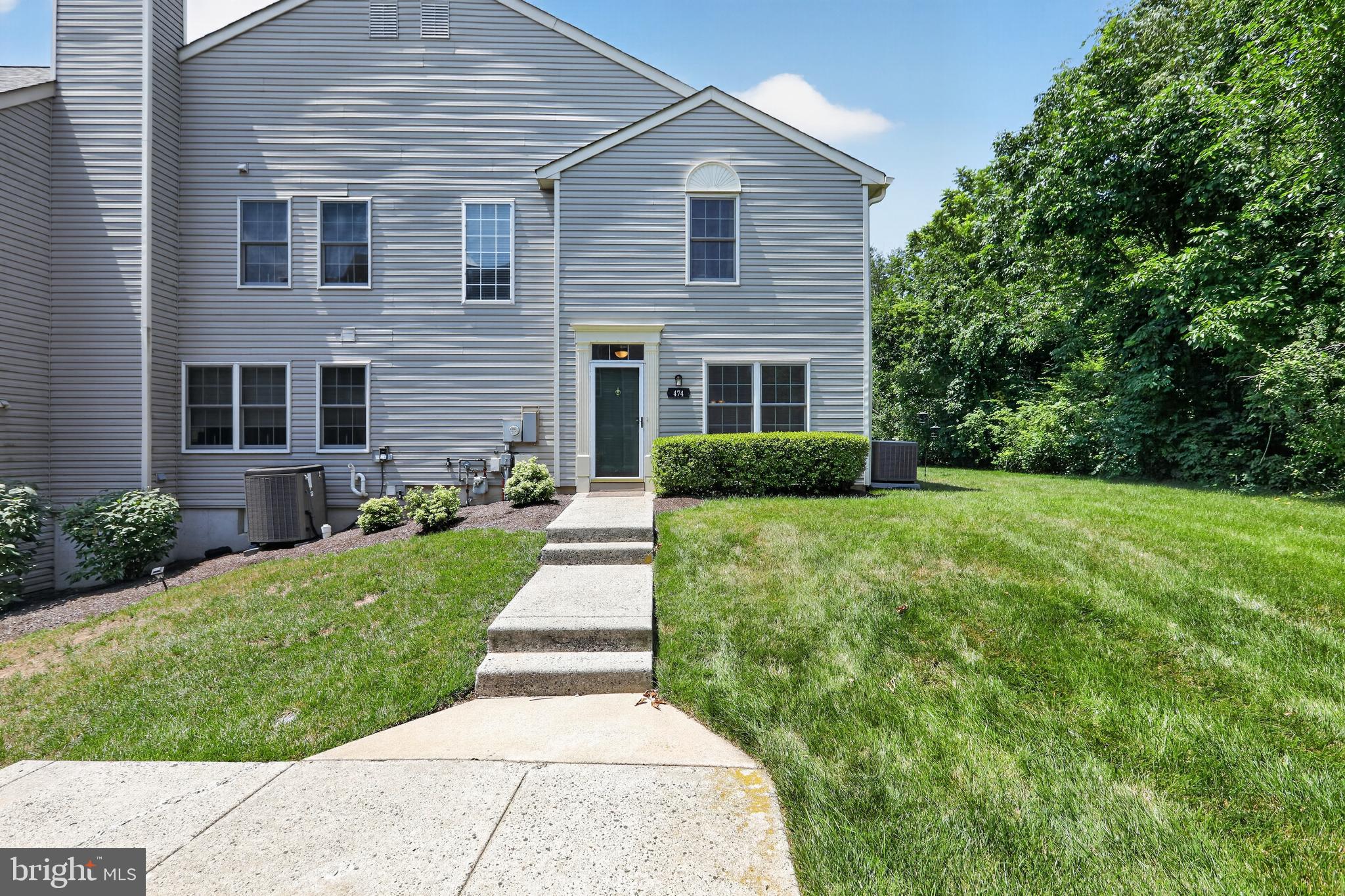 Easy living, Convenient location, Private setting, Super community amenities - what more can you ask for with this nicely appointed Providence View condominium! Set away from the parking lot and backing to a wooded area, this unit offers a private location in the neighborhood. Enter the foyer with a nice sized closet including significant under stair storage, and a convenient half bath. Beautiful hardwood flooring compliments the main living areas. The living room with a double window flows into a spacious dining area or style as a great room. The newer slider leads to a patio for your outdoor enjoyment. There is also a large storage closet next to the patio. The large kitchen, open to main living area, with granite counters, deep undermount sink, primarily stainless appliances and pantry makes meal prep a joy. The kitchen is large enough for an eat-in option or add an island for even more prep and storage. Upstairs you'll find 2 spacious bedrooms, the primary suite with vaulted ceiling and double window, full bathroom with stall shower and large walk-in closet, and a 2nd bright bedroom with back and side windows and large closet. The 2nd bedroom is serviced by a full hall bathroom with tub/shower. The 2-story stairway with large window welcomes in additional natural light and there is a large linen closet at the top of the stairs. Living is easy at Providence View with the tree lined sidewalks and areas of open space, beautiful pool and clubhouse with fitness center and tennis court. Additionally, exterior building maintenance, lawn/landscaping, snow and trash are all covered by the condo association. The community is conveniently located to vibrant downtown Phoenixville with its great shops, restaurants and community event, Providence Town Center for shopping, Corporate centers, major routes and Spring-Ford school district. Additionally, shopping at King of Prussia and the Premium Outlets is just a few minutes away. Come check it out!