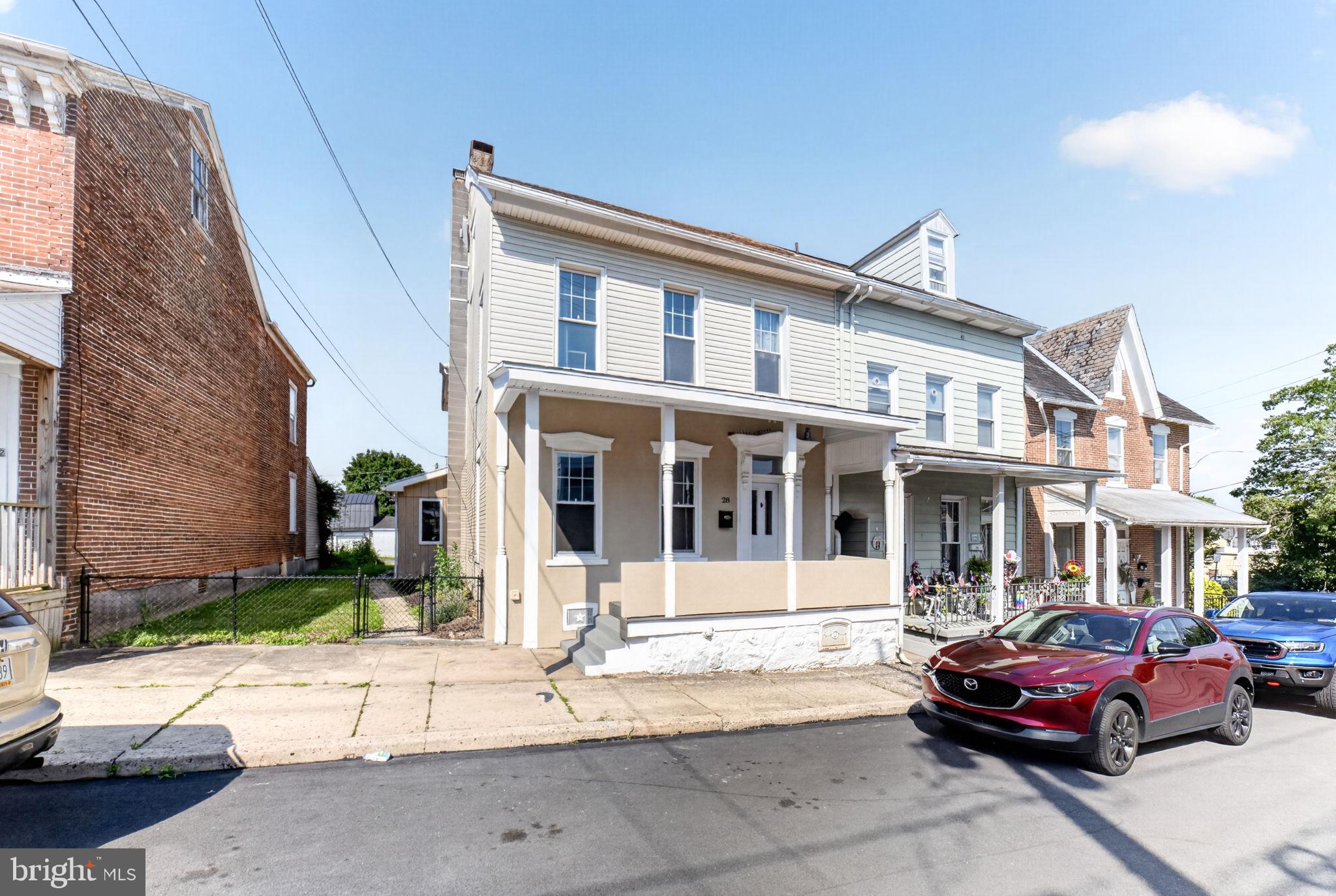 Welcome to this beautifully updated end-unit townhouse in the heart of Emmaus, offering the perfect blend of character, modern finishes, and everyday convenience. This spacious home features a rare attached two-car garage and has been thoughtfully updated both inside and out. Step onto the inviting covered Trex front porch and into a bright, open interior highlighted by soaring 10-foot ceilings, abundant natural light, and a stunning wood staircase. The renovated kitchen is the heart of the home, featuring quartz countertops, stainless steel appliances, a large center island, and plenty of space for cooking and gathering. The first floor also offers a spacious family room, a full bathroom, and a generous mudroom/laundry room with direct access to the backyard and attached garage. Upstairs, a second staircase leads to a generously sized rear bedroom with an adjoining bonus room—ideal as a home office, nursery, dressing room, or walk-in closet. A full attic and basement provide exceptional storage. Located just minutes from the vibrant shops, restaurants, and parks of downtown Emmaus, with easy access to major commuter routes, this meticulously maintained home is truly move-in ready. Don't miss the opportunity to make this exceptional property your next home!