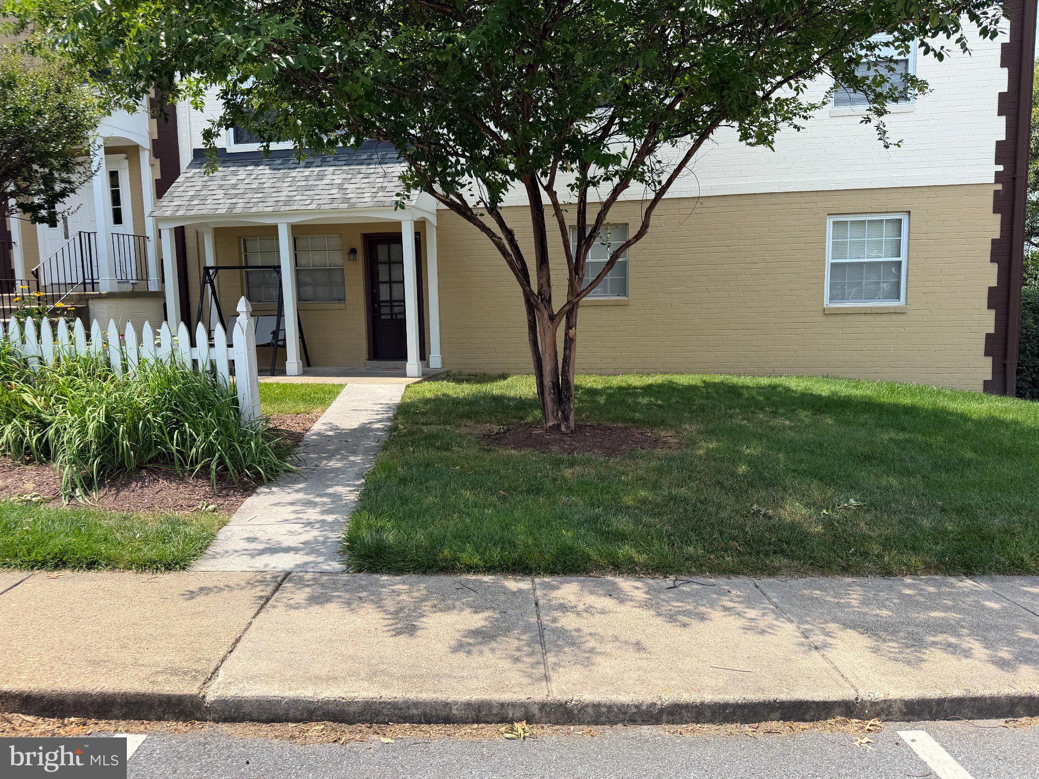 This well-maintained condo is a solid brick construction, offering both durability and charm. The unit is conveniently located on the lower  level and is uniquely accessible through two entrances- one from the main building and another directly from the parking lot.
Providing exceptional ease of access, especially for seniors or when carrying heavy items, with no need to use stairs. The home features a welcoming front porch ideal for relaxing on pleasant day, situated in a quiet and peaceful community. Interior highlights include newer wood flooring throughout and an updated kitchen . The low monthly condo fee of $575 included gas, electric and water, adding excellent value and convenience . This is a rare opportunity to own a highly accessible and well=appointed unit in a desirable setting.