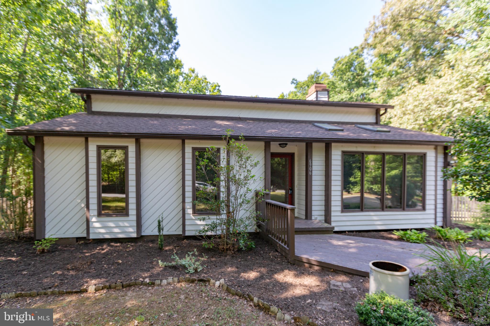 Welcome home to this beautiful contemporary ranch situated on a picturesque .85-acre wooded lot, offering the perfect blend of peaceful living and everyday convenience. Set back from the road, this property provides a serene setting while remaining just minutes from shopping, dining, Lake Anna, and major commuter routes.  Step inside to discover an open and inviting floor plan featuring hardwood floors, vaulted ceilings, skylights, and a warm gas fireplace that anchors the spacious great room. The kitchen offers granite countertops, a stainless-steel appliance package, and flows effortlessly into the dining area that leads to the rear screened in deck—perfect for indoor and outdoor entertaining. The primary suite is designed for relaxation with private access to the rear deck and an en-suite bath featuring a jetted soaking tub, separate shower, and double vanity. Two additional bedrooms and a full hall bath provide comfortable accommodations for family, guests, or a home office. Enjoy the beauty of the outdoors from the screened porch or expansive deck overlooking the private, wooded backyard. Whether you're sipping your morning coffee, hosting friends, or simply unwinding after a long day, this outdoor space is sure to become a favorite. The spacious yard offers plenty of room for gardening, recreation, or pets, while two storage sheds provide ample space for tools, equipment, and hobbies.