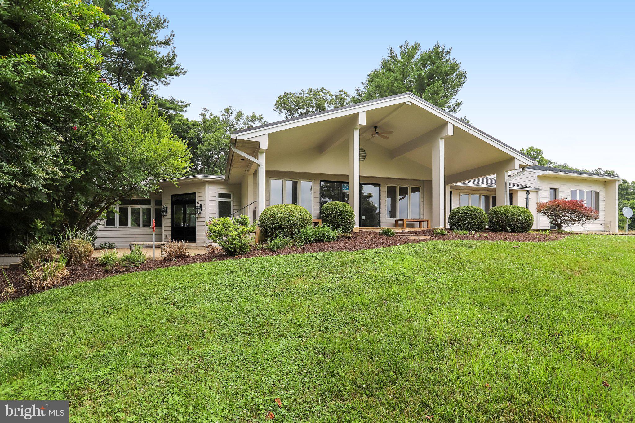 Swimming Pen Farm — the original estate on ±70 private acres, where serenity meets possibility.


At the end of a long, tree-lined drive sits a rare Loudoun opportunity that simply can't be recreated: the original, lovingly-maintained residence — a cherished one-owner home before its sale — now offered on ±70 acres of open pasture, mature woods, and a 5-acre spring-fed pond, with abundant wildlife and recreational land to explore, roam, and enjoy. Enjoy true one-level living, with walls of glass framing sweeping field-and-tree-line views from nearly every room. At the heart of the home, a custom-designed gourmet kitchen with a large center island, double ovens, a warming drawer, and two dishwashers — a dream for the avid cook and effortless for entertaining. A light-filled great room made for gathering, a fireside living room, and a custom built-in library. The spacious primary suite is a private wing all its own — complete with a fireplace, a dedicated private office, and an adjoining flex room, the perfect owner's retreat for work, rest, and everything in between. A flexible 4-to-5 bedroom layout, a 4-car garage, and a pole barn ready for animals, hobbies, equipment, or toys. A covered porch overlooks it all — with room to roam in every direction. Here you'll find the best of both worlds: the privacy and space of the country, with a new luxury community taking shape just beyond your tree line. Ideally set in coveted Western Loudoun — surrounded by award-winning wineries, craft breweries, and farm venues, with antique trails, the Potomac River, charming small towns, and local restaurants all close at hand, plus easy access to shopping and Dulles International Airport. No matter the direction, there's something for everyone. Bring your vision — private escape, gentleman's farmette, or family compound — a place to slow down and savor the daily. Land like this, in this location, does not come again.***Currently in Land Use****Considered a Home Preservation Lot with an Pen Space Easement.