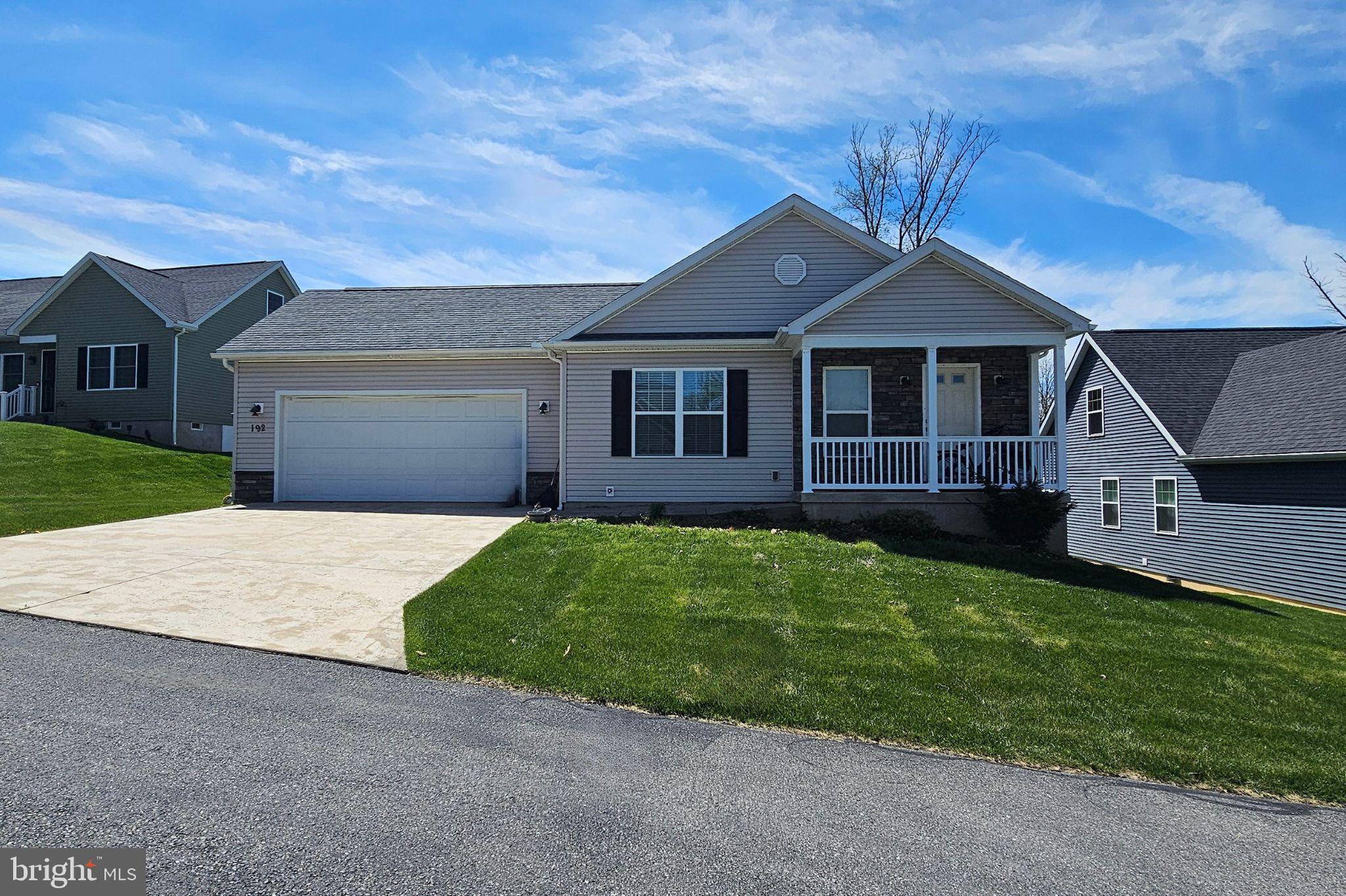 Come tour this affordable home in Boalsburg, located within the highly desirable State College Area School District. This charming ranch-style residence showcases solid hardwood flooring throughout the main living areas, including the great room, kitchen, dining space, and hallways—creating a warm and inviting first impression. The well-appointed kitchen features painted maple cabinetry, granite countertops, a single-bowl undermount sink, stainless steel appliances, and a spacious island—perfect for both everyday living and entertaining. The adjacent eat-in dining area flows seamlessly into the great room, offering an open-concept layout that’s ideal for gatherings and modern living. Down the hallway, you’ll find two comfortable bedrooms and a full bathroom, perfect for family members or guests. Tucked away at the rear of the home is the private primary suite, complete with a generous walk-in closet and an en-suite bathroom featuring a 5-foot shower. Additional highlights include a convenient laundry area, attic storage, and an oversized two-car garage that opens to a relaxing outdoor patio—perfect for enjoying quiet evenings or hosting friends. Situated in the Boalsburg area, this home offers an easy commute—just 10 minutes to downtown State College and Penn State, and under 30 minutes to Lewistown. Please note: This property is being sold as-is, and interior photos are from a previous listing and have been virtually staged.