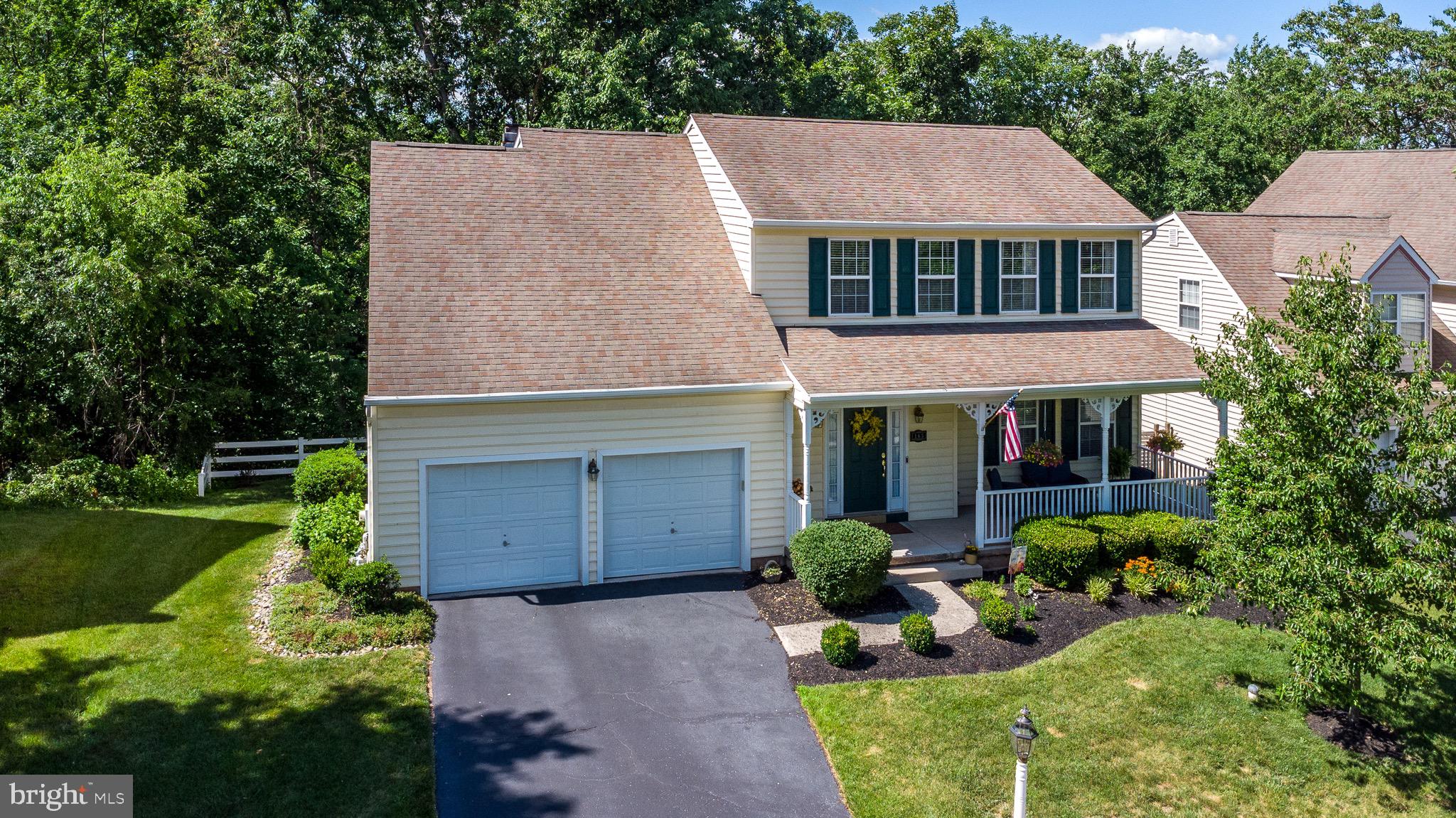 Welcome to 165 Glenwood Avenue, a beautifully updated Colonial tucked away on a private dead-end cul-de-sac in the heart of Historic Collegeville Borough and the highly acclaimed Perkiomen Valley School District.

As you drive through the charming borough and turn onto Glenwood Avenue, you’ll immediately appreciate the peaceful setting and inviting curb appeal of this exceptional home. Imagine relaxing on the covered front porch, enjoying the quiet surroundings and welcoming neighborhood atmosphere.

This meticulously maintained 4-bedroom, 2.5-bath detached home offers the perfect blend of classic charm and modern updates. Beautifully decorated and showing like a model home, the property underwent extensive renovations in 2024, including a stunning brand-new kitchen and updated bathrooms. The kitchen features premium Bosch appliances, including a refrigerator and dishwasher, and overlooks the spacious family room, creating an ideal space for entertaining and everyday living.

The inviting family room is centered around a cozy fireplace and offers picturesque views of the wooded backyard. Whether you’re gathered with family and friends or enjoying a quiet evening at home, this warm and welcoming space is sure to become a favorite. Sliding glass  doors with inset blinds lead to the large rear deck where you can relax and enjoy the privacy and serenity of the tree-lined setting.

Throughout the home you’ll find solid wood flooring, adding warmth and elegance to nearly every room, while the bedrooms feature plush new carpeting for comfort. The formal dining room showcases beautiful wainscoting, while the living room is accented with classic crown molding, adding character and sophistication.

Additional features include a two-car garage, two-car driveway parking, updated powder room and bathrooms, and a secluded wooded backdrop rarely found in such a convenient location.

Living in Collegeville Borough means being surrounded by history, charm, and recreation. Enjoy nearby walking and biking trails, explore the scenic Perkiomen Trail, visit the historic Perkiomen Bridge area, and experience the rich heritage of the borough. Just minutes away is Ursinus College, known for its beautiful campus, outdoor sculptures, and the Berman Museum of Art. Residents also enjoy easy access to local restaurants, shopping, parks, and major commuting routes.

This is a rare opportunity to own a beautifully updated home in one of Montgomery County’s most desirable borough locations. Schedule your private tour today and discover everything 165 Glenwood Avenue has to offer.