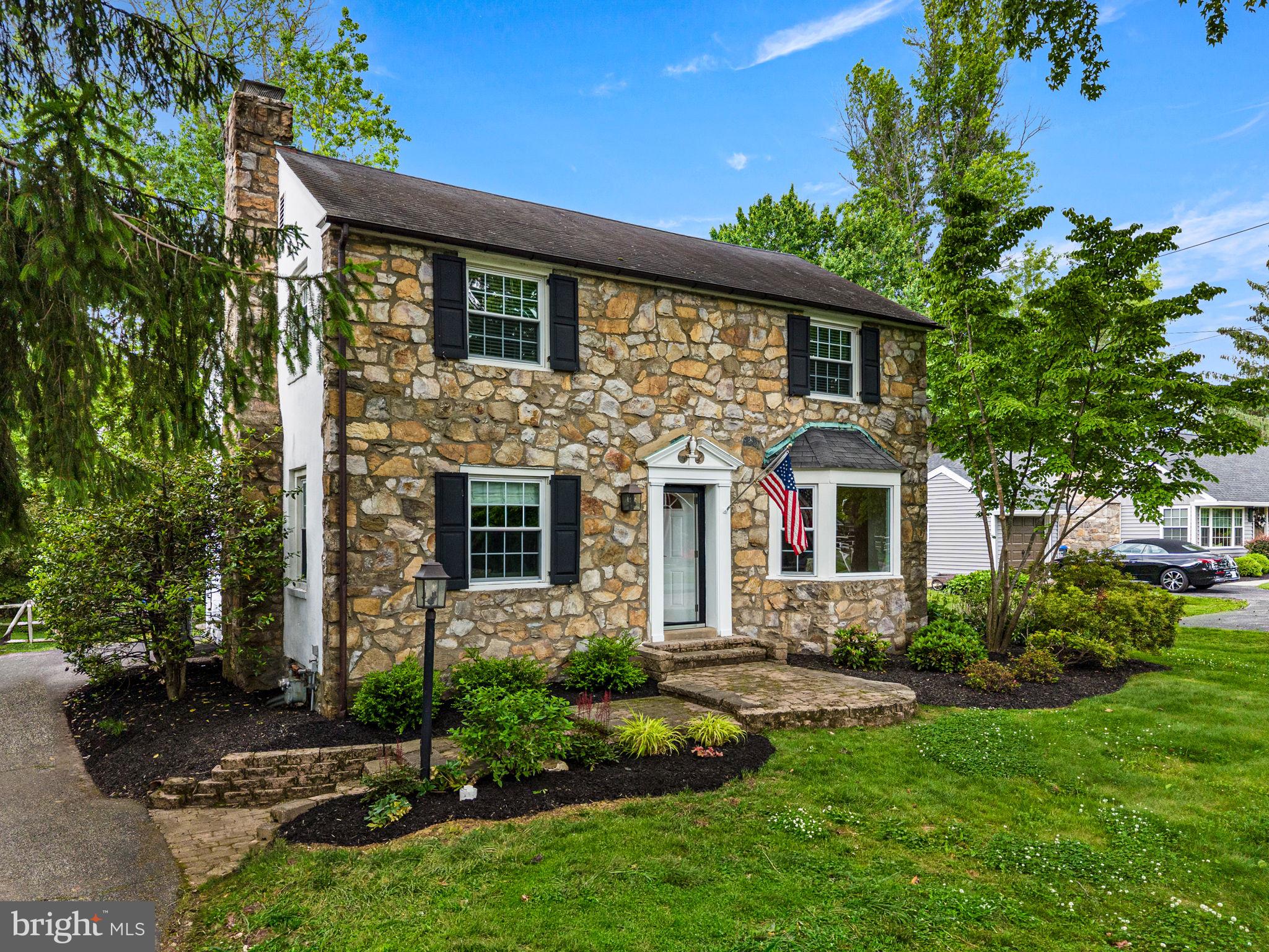 Welcome to 121 Upper Gulph Road, a beautifully maintained center hall stone front Colonial with three bedrooms, two full and one half bath on a flat .41 acre lot in the Shand Tract neighborhood. A charming hardscaped walkway creates a warm and inviting first impression as you approach the home. Inside, the Foyer features graceful arched doorways to the living room and dining room as well as a convenient coat closet.  The beautiful hardwood floors in the foyer continue through most of the house. On the right is the light-filled Dining Room featuring a beamed ceiling and bay window, perfect for both everyday living and entertaining.

The spacious Living Room is filled with natural light and anchored by a classic wood-burning fireplace with a white mantle. Through another graceful arched doorway (added in 2020), you step down into the inviting Family Room renovated in 2020 with new hardwood flooring, a heat circulating gas fireplace built seamlessly into the wall. Glass French doors with rattan blinds provides access from the Family Room to an expansive back deck complete with privacy screening and plenty of room for outdoor dining and grilling. The outdoor living continues with new steps leading down to a paver patio (2023) and a large, lush fenced backyard with a storage shed.

A step up from the family room, the thoughtfully designed Kitchen offers white cabinetry with under-cabinet lighting, black granite countertops and a breakfast bar with seating. Appliances include a Viking oven with gas cooking and stainless steel vented hood (2021), white Whirlpool refrigerator and dishwasher, KitchenAid microwave, and beverage refrigerator. Two windows, one over the sink, and a door to the deck and backyard provide abundant natural light. Just off the kitchen you will find the Powder Room (renovated in 2020), a storage closet, and access to the partially finished Basement which has been freshly painted and features brand-new carpeting. 

Upstairs, the Primary Suite offers hardwood flooring, recessed lighting, a ceiling fan, along with a beautifully updated Ensuite Bath featuring neutral ceramic tile flooring, a walk-in shower with bench seating and shelving, a double vanity with quartz countertops, a gold-bordered mirror, and Rattan Roman shades. The walk-in closet outfitted by California Closets provides exceptional storage and organization. The two additional Bedrooms are equally charming with hardwood floors, chair rail molding, and white wooden blinds.  A renovated Hall Bathroom (2019) features classic Carrara Marble penny tile flooring, a white subway tile tub/shower combination, pedestal sink, and Rattan Roman shades.

Completing the property is a driveway with parking for three cars, including a shared turnaround easement at the upper portion of the driveway for easier access onto Upper Gulph Road. This beautiful home is serviced by the award-winning Tredyffrin-Easttown School District, and is conveniently located near the Strafford Train Station, downtown Wayne, King of Prussia, Valley Forge Park, Chester Valley Trail, major routes: 202, 76, 476, and much more.

ADDITIONAL RECENT UPDATES: HVAC installed in 2023, Sewer Line repaired in 2026 with transferable warranty.  New CertainTeed Landmark PRO Lifetime Dimensional Shingles ROOF to be installed in the next 30 days with transferrable warranty. There is a small portion of flat roof in the back that is in good condition and will not be replaced.