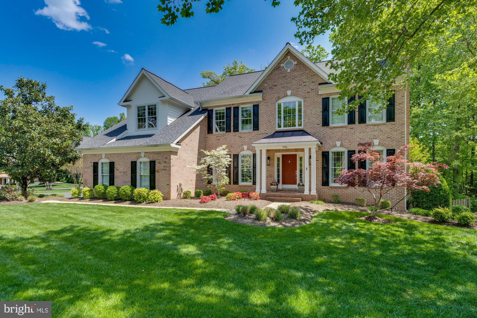 Stunning home in the coveted Manors at Wolf Trap, nestled on a peaceful cul-de-sac with a private wooded 0.35 acre lot. The home boasts a bright and open interior perfect for entertaining, featuring 6 bedrooms, 4.5 bathrooms, and offering 5,557 sq ft of living space over three levels. The layout is ideal for large or small gatherings, including a grand two-story entrance hall, formal dining and living rooms, and a family room with a cozy fireplace. The kitchen shines with its central island, granite counters, custom tile backsplash, walk-in pantry, and a breakfast nook beside a sunroom with vaulted ceiling. The main level also boasts a home office, a mudroom/laundry, and a half bath. The owner’s suite is a retreat with its own fireplace, sitting area, dual walk-in closets, and an spa-like bathroom featuring a soaking tub and a walk-in shower enclosed in frameless glass. The upper level also has a walk-in linen closet and four additional bedrooms, connected by two Jack and Jill baths. The finished walk-out lower level offers a recreation room, home gym, full bath, and the sixth bedroom. Private park-like exterior, complete with a spacious low maintenance Trex deck and a beautifully landscaped, fenced yard that backs to protected woods. Conveniently located a short drive from Vienna's downtown, Tysons, Wolf Trap National Park for the Performing Arts, major commuting routes, and the Metro, within the Westbriar/Kilmer/Marshall pyramid.