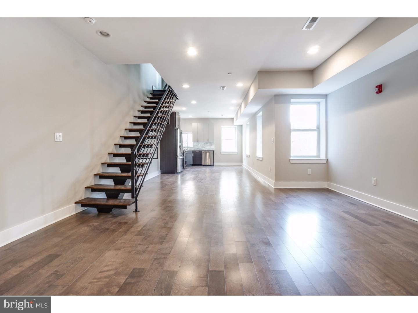 Welcome to 2512 Frankford Ave!  Four spectacular Bi-Level Condos completely renovated throughout.  Unit "C" Main Level features an airy floor plan with plenty of natural light, spacious Living/Dining area, open staircase, contemporary Kitchen with quartz countertop, marble tile backsplash, five burner slide-in gas range, counter depth refrigerator, and hidden control dishwasher.  Upper level contains master bedroom with walk through closet, ultra modern master bath with stall shower, hall laundry,and guest bedroom with private bath. Huge roof top deck with wonderful city views.  Tax abatement approved. Great location! 94 Walk Score. Convenient to Philadelphia Brewing Co, Martha, Memphis Taproom, Pizza Brain, and much more! Easy to show!