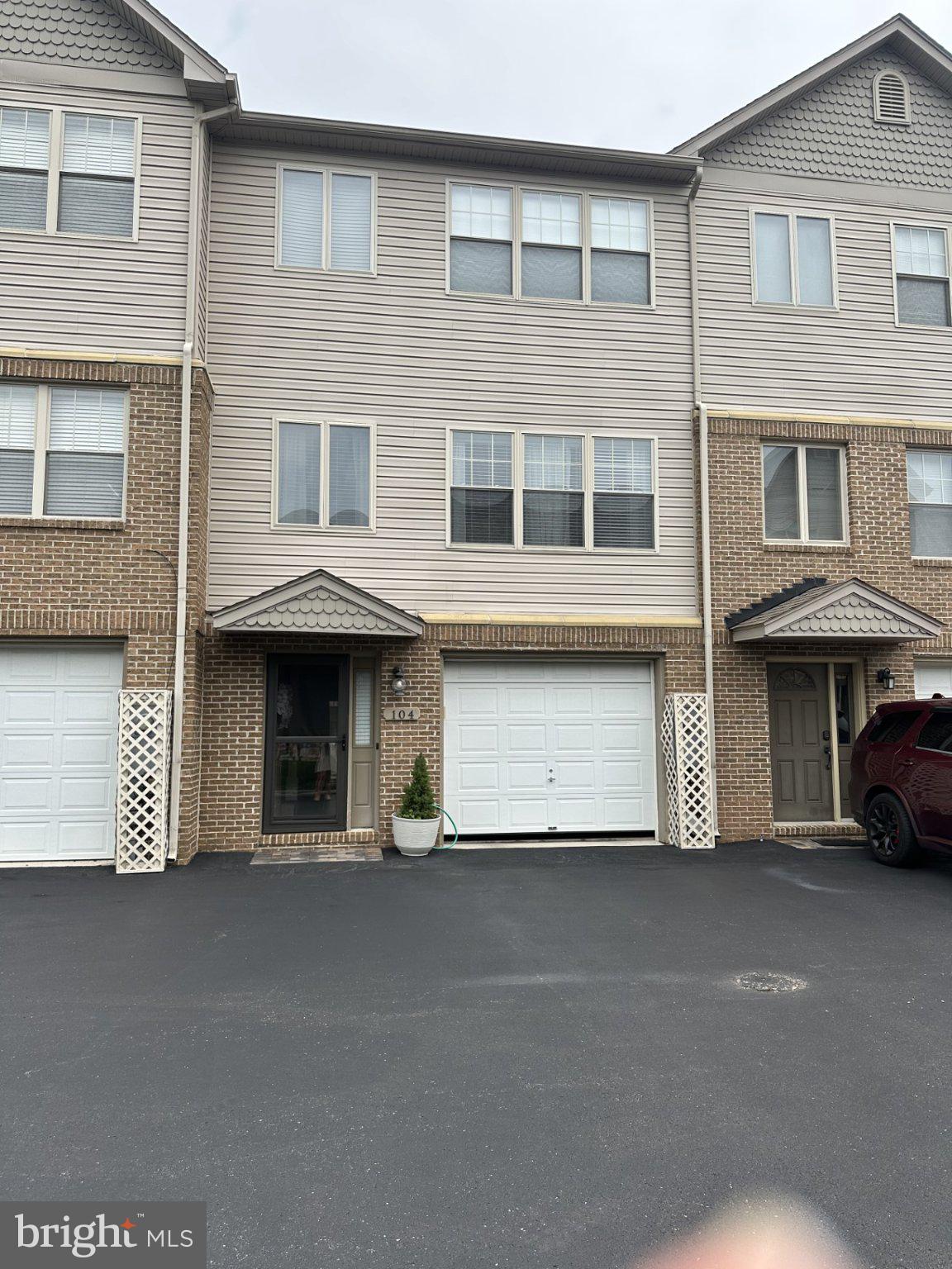 Built in 2007, this townhouse offers stunning hardwood floors in the living room and dining room. Freshly Painted.  Master bedroom with an attached master bath which features a separate tub and showerand large walk in closet.  Open kitchen with granite tile counter tops, space for table and large pantry. Living room is very spacious with lot of natural light, could be living room/dining room combo.  Bonus room on the entry level with a walk out patio. Call us today to see this move in ready townhouse.
