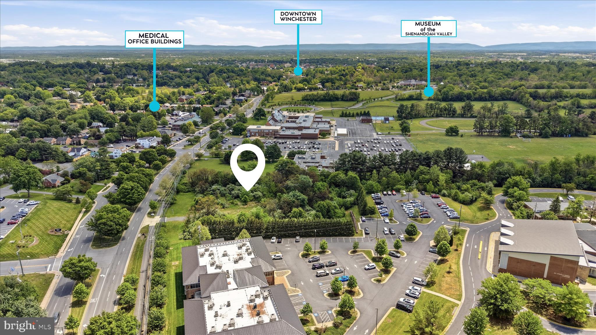 Exceptional 2-acre level commercial parcel in a highly desirable area of Winchester offering strong visibility along a primary corridor into downtown. Ideally located just two blocks from Winchester Medical Center, this property sits in one of the most established and high-demand professional corridors in the city.

The site features excellent road frontage and level topography, providing a versatile footprint suitable for a wide range of professional and service-based uses.

Zoned RO-1 (Residential Office District), the property allows for a variety of low-intensity and compatible uses, including:

Medical and dental offices
Professional offices (legal, financial, administrative)
Outpatient and clinical services
Personal service establishments
Limited residential use in conjunction with office use
Other permitted low-impact uses under RO-1 zoning
Additional uses permissible with conditional use permit, see city's RO1 zoning.

RO-1 zoning is designed to support a professional office environment that integrates well with surrounding residential and institutional uses, making this an excellent fit for medical and professional users seeking proximity to the hospital corridor.

With its close proximity to Winchester Medical Center, strong visibility, and flexible zoning, this parcel offers a rare combination of location and usability in one of Winchester’s most established commercial areas.