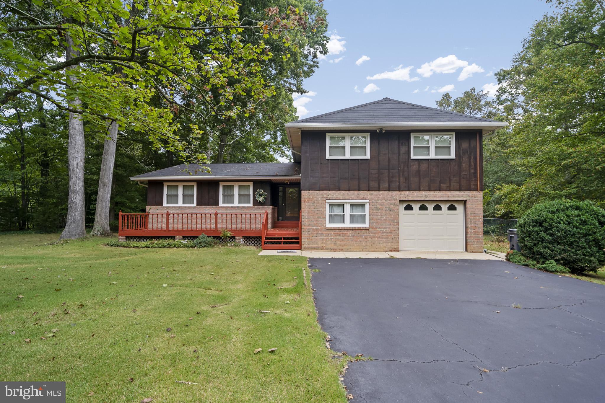 Enjoy this private 1 acre home surrounded by trees. 5 bedrooms, 2.5 baths. Relax out back year round on the screened in porch area or off the master bedroom balcony.   New carpet installed (9/2022) in basement family room. New oil tank (8/2021). Newer windows in front of home (uncertain of year) Property is eligible for 100% Financing USDA Loan for qualified buyers.  Great location for DC/VA/Indian Head Naval Base/Joint Andrews Air Force base commuters. Just Minutes to National Harbor to enjoy your favorite shops & restaurants. NO HOA!