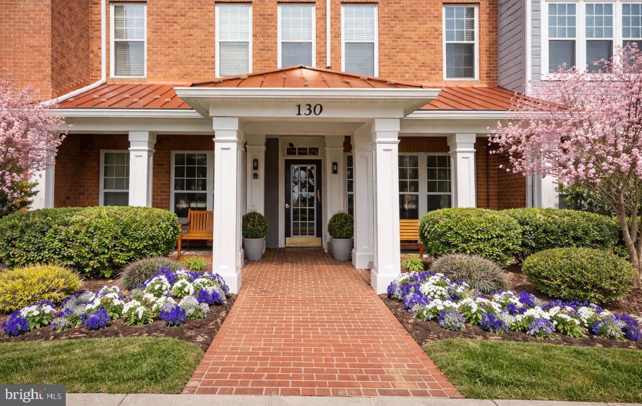 Step into luxury and privacy at 130 Chevy Chase St, Unit 202. This beautifully renovated 1,592 sq. ft. light-filled corner residence with windows on all sides features a designer kitchen, renovated bathrooms with double sinks in the primary bath, and a private garage, all located in a secure elevator building just steps from Whole Foods, the Kentlands town center, shops, cafés, restaurants, and scenic walking trails. Surrounded by mature trees, this exceptional 2-bedroom, 2-full bath home offers peaceful wooded privacy in one of the area’s most desirable walkable locations.
Natural light fills the living areas through large tree-lined windows, highlighting warm wood flooring, fresh custom paint, and new neutral carpeting. Recessed lighting enhances the bright modern feel, while a designer chandelier creates an elegant focal point in the dining area. The open layout is anchored by a marble-tiled gas fireplace and windows offering rare wooded views and exceptional privacy with no neighboring building directly facing the residence.
The chef’s kitchen features 42-inch ceiling-height cabinetry with glass display uppers, under-cabinet lighting, white quartz countertops, a dramatic leathered-granite island, marble backsplash, and high-end stainless appliances including gas cooking—perfect for everyday living and entertaining.
The primary suite includes a large walk-in closet plus an additional closet for extra storage. Bathrooms feature quartz countertops and modern hardware, while the primary bath offers double sinks and solid wood cabinetry. A slate-floored laundry room with built-in cabinetry provides excellent storage and convenience.
Enjoy the oversized private balcony overlooking mature trees, creating a peaceful outdoor retreat with rare wooded privacy—perfect for morning coffee or evening relaxation.
Updates include 2023 HVAC, 2020 water heater, and 2025 dishwasher. The private garage with painted flooring and shelving provides secure parking and extra storage.
Residents enjoy access to pools, clubhouse, fitness center, tennis and pickleball courts, lakes, trails, and the Arts Barn. With easy access to the Beltway and Metro, this home
offers resort-style living in the heart of the Kentlands.
Homes offering this level of privacy, natural light, craftsmanship, and walkable convenience rarely come to market—a truly exceptional opportunity.