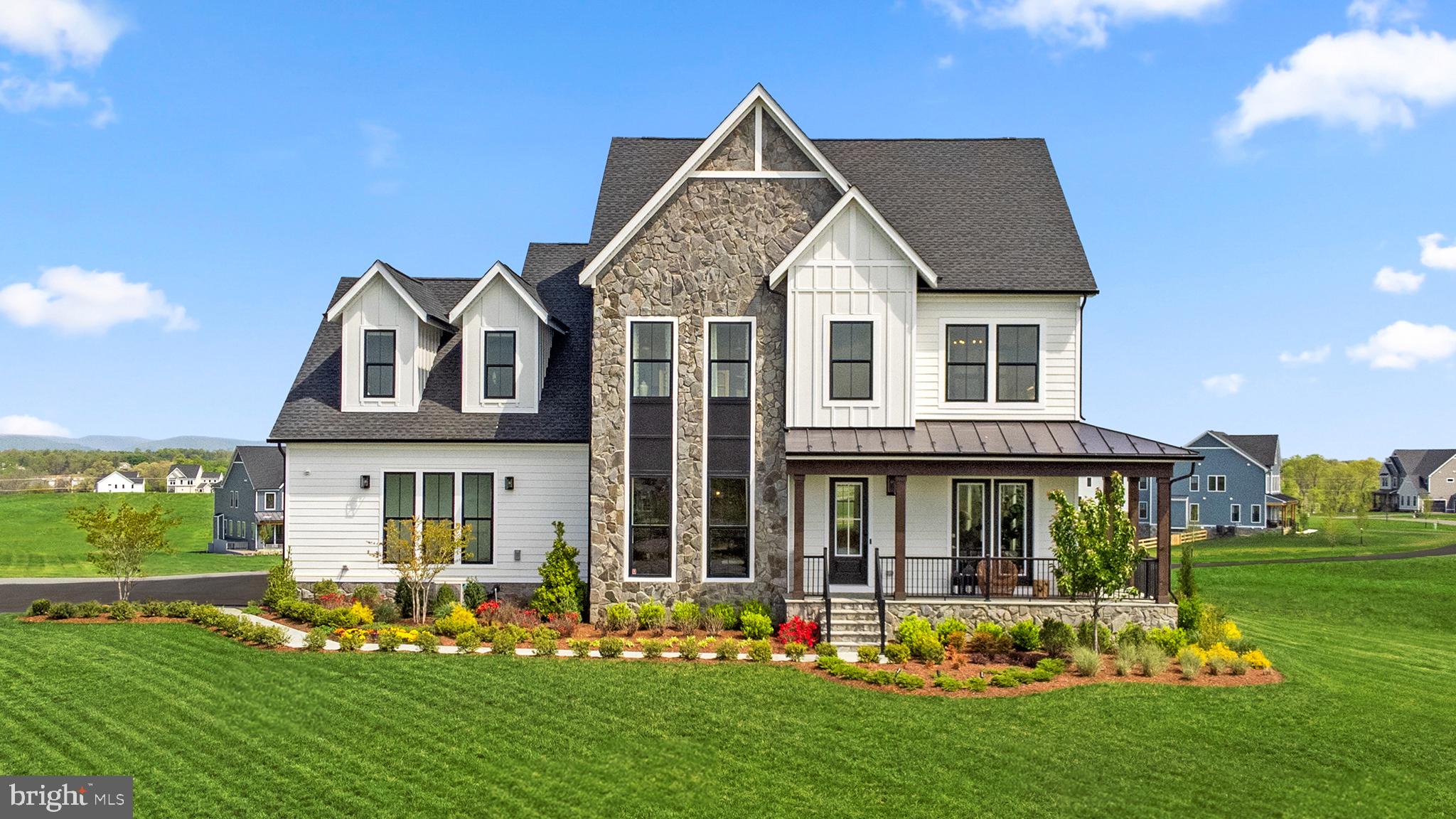 Seize the extraordinary opportunity to own this breathtaking DESIGNER MODEL SINGLE FAMILY HOME, nestled on a sprawling 4.12 acre homesite! This incredible home by Van Metre Homes at GLENMORE FARM is ready to move in AUGUST 2025! Experience the height of luxury living with the TIMBERNECK III floorplan. Boasting 6,514 square feet on three levels, this exquisite residence offers 6 bedrooms, 5 full and 1 half bathrooms, and a 3-car garage, setting a new standard for sophisticated living. As you enter this beautiful abode, you are greeted by an expansive open floorplan under 10 ft. ceilings featuring an inviting great room with roaring fireplace, a private study, and distinct areas for living and dining—an entertainer's dream. The grandeur continues into the spacious gourmet kitchen complete with two islands, upgraded floating cabinets, quartz countertops, stainless-steel appliances, a chef's pantry with solid shelving, a luxurious culinary kitchen wet bar, and an inviting eat-in breakfast room. A wraparound front porch, screened-in porch off the chef’s pantry, and a walkout deck with patio off the dining room make this home ideal for seamless indoor-outdoor living The upper level is a sanctuary of its own, showcasing an impressive primary suite with a large walk-in closet and a lavish 5-piece bathroom, complete with double sinks, an oversized shower with a built-in seat, and a dramatic freestanding tub. Four additional secondary bedrooms, three full baths, and a convenient upstairs laundry room add to the allure. But that is not all! The basement level provides two large rec rooms, media room, executive wet bar,  additional bedroom, and full bathroom providing additional space to complement your lifestyle. Being a new build, your home is constructed to the highest energy efficiency standards, comes with a post-settlement warranty, and has never been lived in before! Elevate your lifestyle in this meticulously crafted home that seamlessly blends elegance with functionality, providing an unparalleled living experience for those who seek the finest in every detail. Schedule an appointment today! ----- Discover Glenmore Farm, a Van Metre single family home neighborhood destined to become a premier community in the Loudoun Valley area. Offering a distinct small-town feel and access to excellent schools, Glenmore Farm is designed for everyone. Nestled in the bucolic countryside of western Loudoun County, the neighborhood boasts 3+ acre homesites with spacious homes, grand porches, and sweeping views of the Blue Ridge mountains. Just minutes from Waterford and downtown Purcellville, residents enjoy the tranquil ambiance and picturesque surroundings. Glenmore Farm ensures a seamless blend of modern amenities and country living, making it a truly desirable place to call home. -----Take advantage of closing cost assistance by choosing Intercoastal Mortgage and Walker Title. ----- Other homes sites and delivery dates may be available. ----- Pricing, incentives, and homesite availability are subject to change. Photos are used for illustrative purposes only. For details, please consult the Community Experience Team.