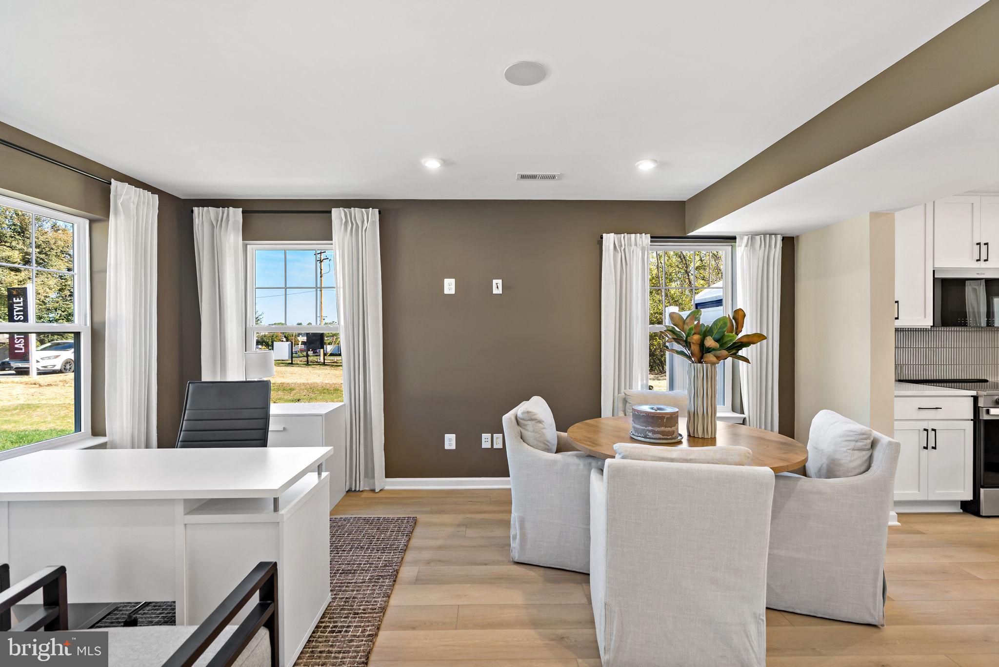 OFFERING UP TO $12,500 IN CLOSING COST ASSISTANCE FOR PRIMARY RESIDENCE WITH USE OF APPROVED LENDER AND TITLE!**   Welcome to Homesite 80, a beautiful end-unit townhome designed with extra space, natural light, and thoughtful upgrades throughout. Featuring 3 bedrooms, 2.5 bathrooms, and one of the community's most desirable floorplans, this home offers the perfect blend of style and functionality. From the moment you arrive, you'll appreciate the impressive curb appeal and spacious two-car-wide driveway, providing parking for up to four vehicles. The exterior showcases horizontal siding, board and batten accents in the gable, and decorative shutters, creating a charming and timeless look. Step inside and you'll immediately notice the bright, open layout enhanced by the additional windows that come with an end-unit home. Just off the entry, a convenient powder room is perfectly situated for guests before the home opens into the main living area. The kitchen is sure to impress with beautiful white cabinetry, elegant crown molding, a spacious island with pull-out trash can, a single-bowl sink, and stainless steel appliances. The upgraded premium refrigerator adds both style and functionality, creating a polished look throughout the kitchen. One of the standout features of Homesite 80 is the highly sought-after morning room extension. Located just off the dining area, this additional living space fills the home with natural light and provides the perfect spot for a larger dining table, reading nook, home office space, or cozy sitting area. Even better, the extension carries upstairs into the primary suite, creating extra square footage where you'll appreciate it most. As you step into the backyard, you'll find an attached storage shed, providing valuable space for lawn equipment, seasonal décor, and additional storage needs. Heading upstairs, you'll love the wider staircase design featuring two spacious landings, making the transition between floors feel open and inviting. The thoughtful layout adds both character and convenience to the home. The spacious primary suite is the true highlight of the second floor. Thanks to the morning room extension, you'll enjoy even more room to create your perfect retreat. The suite also features a large walk-in closet and an ensuite bathroom complete with a standing shower with built-in seat, double bowl vanity, and linen storage for added convenience. Two secondary bedrooms are located at the front of the home and share a full hallway bathroom, making the layout ideal. The upstairs laundry room keeps everyday chores simple and convenient. With its desirable end-unit location, four-car parking capacity, bright open layout, and rare morning room extension that adds living space on both levels, Homesite 80 offers a unique opportunity to enjoy one of the most spacious and functional homes available at Villages at Courthouse Square.*Photos may not be of actual home. Photos may be of similar home/floorplan if home is under construction or if this is a base price listing.