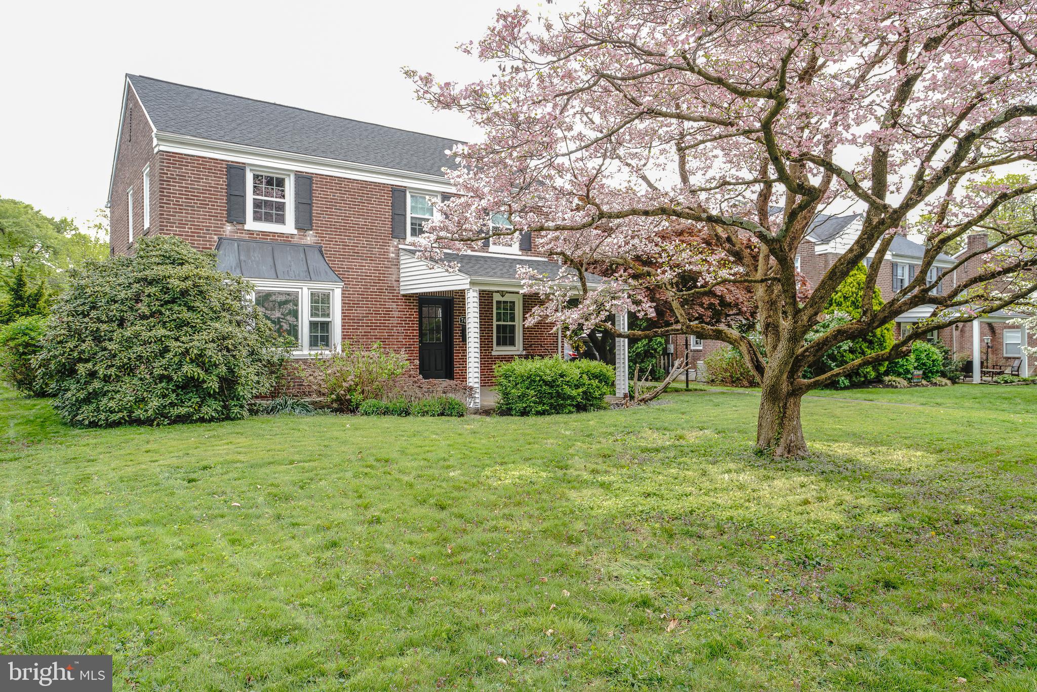 Beautiful birck colonial single  in desirable Oak Lane Manor !.   Long 3 plus car driveway and attached 1 car side garage .  Front covered patio . Formal living room with hardwood floors , brick wood burning fireplace and newer windows .  Formal dining room with hardwood flooring,chandelier, and newer windows . Modern eat in kitchen with ceramic tiled flooring , stainless steel gas range , stainless steel refrigerator , stainless steel sink , stainless steel dishwasher , granite counter tops , cherry cabinets with crown moldings . Exit from kitchen to rear covered cement porch . Lovely rear fenced level yard . Semi finished basement laundry , storage ,powder room ,  and recreation room !! . 2nd floor offers rear Primary bedroom with newer modern primary bath with stall shower , tiled floor and walls.  2nd bedroom with hardwood floors ,ceiling fan closet . 3rd bedroom with hardwood floors , closet . HVAC 2006, Newer roof . Newer windows , newer driveway . Attic storage . Close to public transportation and shopping on Cheltenham ave !!