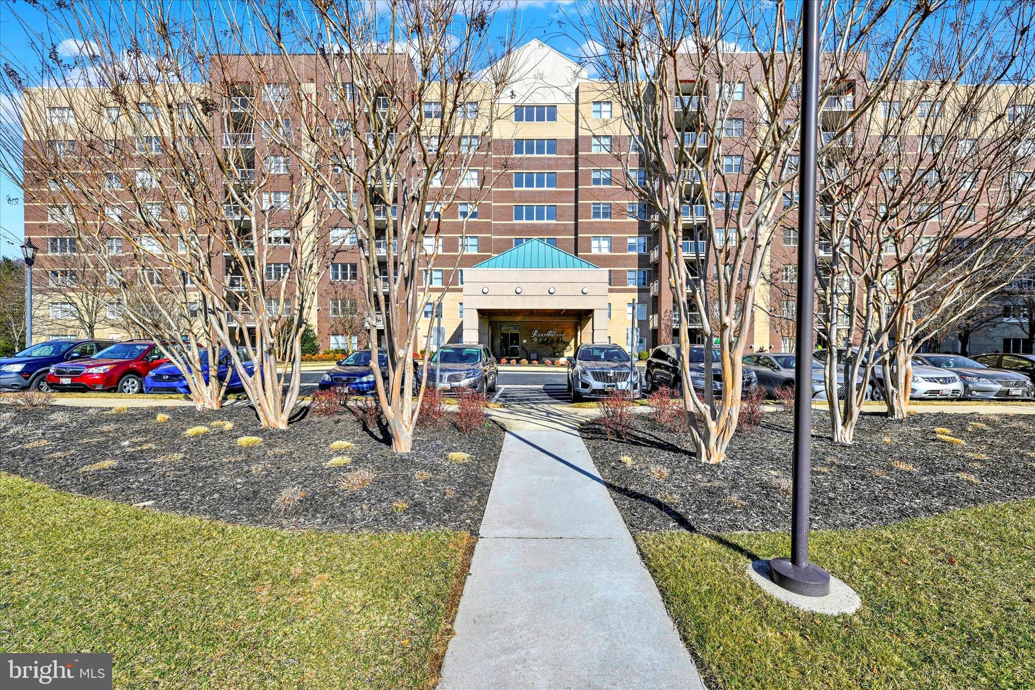 Beautiful, Gently Lived In, Clean As a Whistle, 5th Floor Condo with Fabulous Natural Light & Many Upgrades, Overlooking the Gazebo!  Enjoy Easy Living with Neutral Decor and Lovely LVP Flooring in the Main Living Area, Neutral Carpet in the Bedrooms and Wonderful Window Treatments Throughout.   Cherry Cabinetry in the Kitchen with Granite Counters.  Balcony with Solar Shade.  HVAC 2021.  Extra secure Storage Bin on the Same Floor. Tasteful Building foyers and hallways Have Been Newly Refurbished.  Two-Elevator Building & Conveniently  Located Trash Chute On the Same Floor.  Close to Graul's, Restaurants, Banking, Voluntary Community Pools and Many Other popular Amenities.  Easy Access to I-83 & 695.  Ample parking in front and in back of building! This is the One You've Been Waiting for!