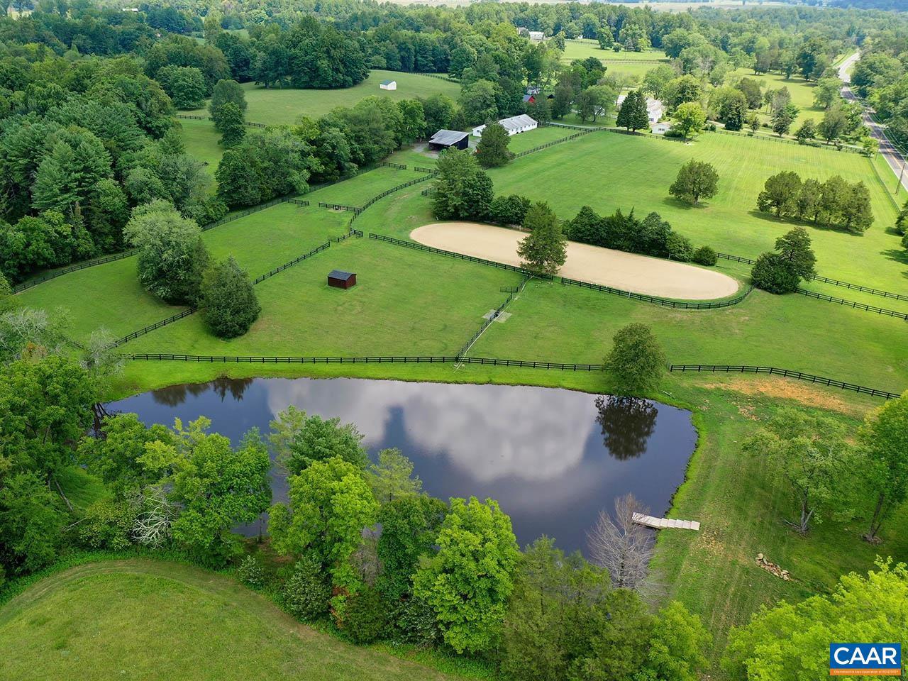 Price Reduced! Welcome to Kesmont, an idyllic 46-acre horse farm nestled in the stunning countryside of Keswick, VA, where both you & your horses will enjoy living. Tailored for equestrian enthusiasts, this property boasts functional facilities & cozy living spaces. It features 5 paddocks with automatic waterers & 4 run-in sheds. The 10-stall center aisle barn, refreshed with new Pella windows & paint, includes a wash rack, tack & feed rooms. Additionally, there's a new three-bay garage with a 50 amp RV connection, alongside equipment & hay barns. The farm is secured by 2 solar-powered gates.  The charming Cape Cod-style home has been beautifully remodeled, featuring 3 bedrooms & 3.5 baths, including a 1st-floor primary suite, a new gourmet kitchen, new HVAC, new Pella windows & doors, & 2 generators capable of powering the entire farm. Outdoor living is enhanced with a new pool/hot tub & a spacious deck area, complemented by a picturesque pond. A renovated farm manager?s apartment offers a new kitchen & bath.   Just a short drive from local amenities & vibrant community activities, Kesmont offers a perfect blend of pastoral charm & modern convenience. This is a place where you & your horses will love!,Glass Front Cabinets,Quartz Counter,Wood Cabinets,Fireplace in Living Room