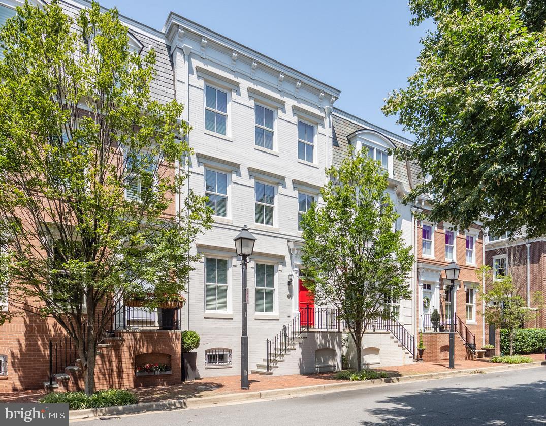 Rarely available home in sought-after BACKYARD BOATS HOA. Located in the heart of Old Town,  this elevator-ready,  4 level  property will delight the most discerning buyer in search of a 2-car garage residence. Guest parking w/ 2 resident's permits.  Walk only steps to the piers of the Potomac, cafes, shops, markets & restaurants.  Inside, find such updated features as a recent roof, recent 2-zone HVAC, fresh paint and kitchen updates. Handsome hardwood floors throughout and gorgeous, deep moldings to complement the high ceilings. Enjoy the private, spacious patio, a true "summertime room" just off of the kitchen, ideal for entertaining friends & family.  Four closets stacked above one another were designed for ease of elevator installation, if desired.  You will love it.