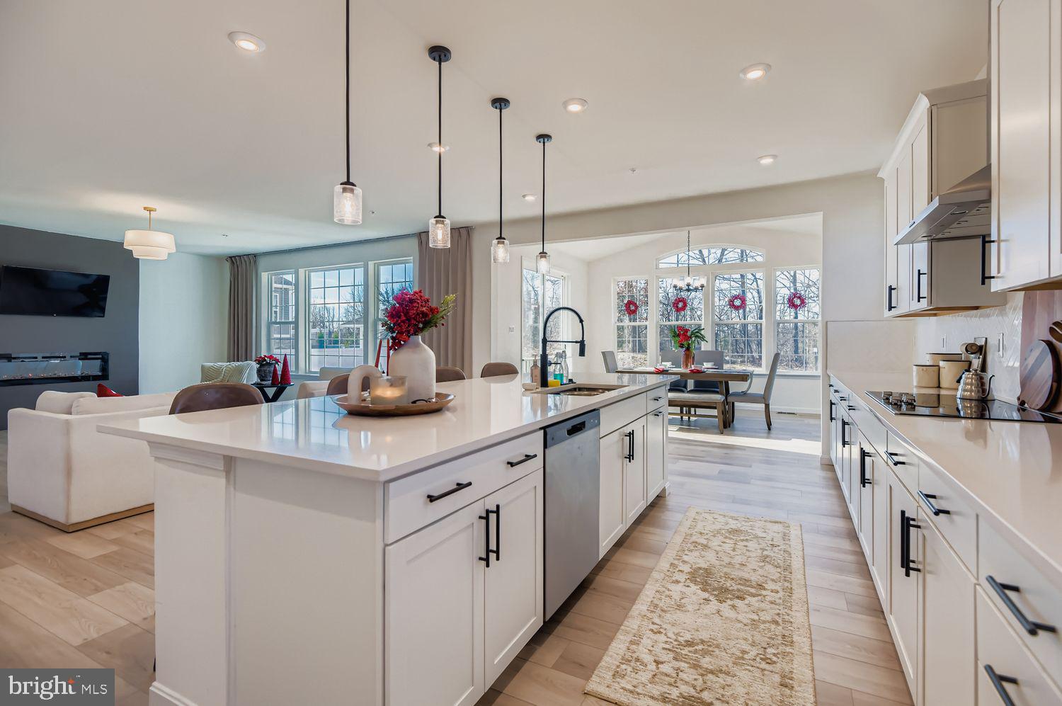 Built in 2024, this impressive home welcomes you with a bright, open main level designed for both everyday living and entertaining. The main floor showcases a grand great room anchored by a sleek electric fireplace, flowing seamlessly into a gourmet kitchen featuring quartz countertops, an oversized center island, herringbone tile backsplash, stainless steel appliances, and ample cabinetry. A sunroom extends the living space and offers the perfect place to unwind while taking in views of the expansive .43-acre lot, while an office and additional den/exercise room provide flexible space for work, fitness, or hobbies.

The second level offers four generously sized bedrooms, including an elegant owner’s suite with a walk-in closet and a luxurious, spa-like bathroom, as well as a large loft providing additional living or entertaining space. A conveniently located second-floor laundry room enhances everyday functionality, while the additional bedrooms and bathrooms offer comfort and privacy for all.

The fully finished lower level adds exceptional versatility with a walk-out design, featuring a fifth bedroom, a full bathroom, and additional recreation or exercise space ideal for entertaining, guest accommodations, or multi-generational living. Plumbing has been installed for a potential future wet bar. Completing the home is a 2-car attached garage and a thoughtfully designed layout that delivers modern comfort, flexibility, and style throughout.

Located in a newly developed community just minutes from the Avenue, Gunpowder Falls State Park, and offering easy access to I-95 and I-695, this home is both convenient and commuter friendly.
