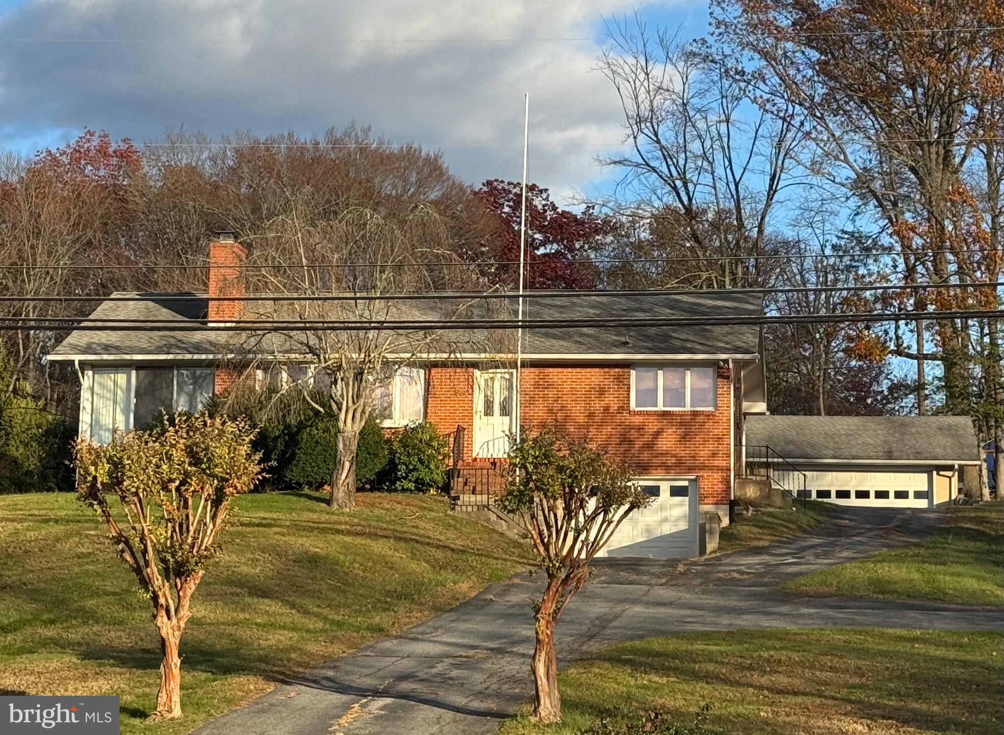 *****$5,000 Closing Cost Incentive!!!*****Solid, Well-Built, 4-SIDED BRICK, Detached, 3 Bedroom, 2 Level, Rancher w/1 Car Attached Garage, 2 Car Detached Garage, on a .505 Acre Setting in Centrally Located and Water-Oriented NORTH EAST**PROPERTY DETAILS: MAIN LEVEL: Spacious Great/Living Room w/Wood-Burning Fireplace w/Decorative Mantle and Glass Doors w/Screen, Extra-Large Bow Window w/North East Overlooking Views, Front Entry Door, Dining Area w/Chair Rail Trim Moldings and 2 Pocket Doors, Eat-In SEARS Kitchen w/Wood Cabinets w/Decorative Trim and Corner Shelving, Table Area, Pantry Closet, Tall, Wrap-Around Casement Windows for Lots of Natural Light and North East Watching, and Side Entry Door, 3  Bedrooms, Hallway w/Full Bathroom, 3 Closets, One w/Laundry Drop, and a Pull-Down Attic Stair for Easy Attic Access, All Season Florida Room w/Exposed Brick Wall, Wrap-Around Glass Sliders w/Screens, and Level Rear Entry Door, Hardwood Flooring Under Some Carpeting, Great Natural Light Throughout**LOWER LEVEL: Front Recreation Room w/Garage Access Door, Rear Utility/Storage/Mechanicals Room, Laundry Area w/Full-Size Washer and Dryer, Deep, (12x30) Attached Garage w/Auto-Opener and Front Entry Roll-Up Door**OTHER INTERIOR: All Appliances Included, Central Air Conditioning System, All Existing Ceiling Fans Included**EXTERIOR: .505 Acre Setting, Front Entry Porch, Side Entry Porch, 2 Car (24x20) Detached Garage w/Auto-Opener, Front Entry Roll-Up Door, and Side Entry Service Door, Long Crossover Macadam Driveway w/ Parking and Space for Multiple Cars and/or Boat/Trailer/RV, Brick Fireplace Chimney**UTILITIES: PUBLIC SEWER, New Well and Well Tank (2024) w/New Conditioning System (2025)**LOCATION: No HOA, No Town Taxes (Located Just Outside the Town Tax Limit, Front Lawn View of the July 4th Town Fireworks**COMMUNITY: Excellent Location for EASY ACCESS to the Water Fun of the nearby North East River, the Elk River, the Chesapeake and Delaware Canal, and the Susquehanna River, and to the Popular Area Parks (including North East Park, Elk Neck State Park, Elk Neck Forest, Perryville Park, More), Marinas, Historic Towns (including North East, Chesapeake City, Perryville, Port Deposit, Havre de Grace, More), Waterside  and Area Attractions, Restaurants and Amenities (Hollywood Casino, Great Wolf Lodge, Golf Courses (Furnace Bay, Chesapeake Bay, Patriots Glen National, Bulle Rock, More), the Perry Point VA Medical Center, Aberdeen Proving Grounds, MARC Train Travel and Interstate 95 Convenience for Travel to Baltimore, Washington, Delaware, Philadelphia and New Jersey**SCHOOLS: North East High School / North East Middle School / North East Elementary**AVAILABILITY:  Come Take a Look, Property is Easy-to-See w/Appointment or at Open House. Quick Settlement and Occupancy is Available, More!!!