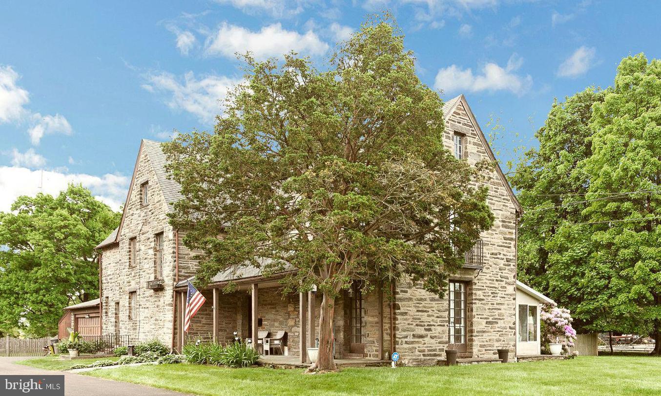 Just Reduced!  Welcome to this gorgeous stone colonial home complete with 1+ acres of subdividable land, which includes a completely fenced-in rear yard, with a beautiful landscape, rear deck, in-ground pool, and private access to the local playground and walking path.  As you enter the foyer, you are welcomed with beautiful decor and  high ceilings; this main level of the home flows from a bright and airy living room to a modern, completely rehabbed gourmet open kitchen, creating an ideal space for gatherings and entertaining.

The kitchen displays custom cabinetry, granite countertops, and top-of-the-line appliances. and just off to the side is a newly renovated powder room and convenient mudroom, which offers ample storage and access to the attached two-car garage.

Ascending the staircase, you'll discover four spacious bedrooms on the second floor, two of which feature charming Juliet balconies, accompanied by two fully-renovated bathrooms. The third floor retreat boasts two additional bedrooms, a third full bath boasting a clawfoot tub and pedestal sink, and an expansive finished attic space ideal for storage, a gym, office, or a recreational haven.

The lower level presents a basement in impeccable condition, housing a newer gas heater, extra large hot water heater, in-home office, laundry area, and 200-amp electrical service. Step outside to the expansive wooden deck overlooking the fenced-in pool area and over an acre of meticulously manicured yard space, which conveniently has access to a walking trail, playgrounds and ball field. 

This home offers easy access to downtown Wyndmoor, Chestnut Hill, and major transportation routes including Routes 309, 276, 476, and Center City; it is just steps away from restaurants, shops, schools and more.  Be sure to check out this perfect blend of historic allure and modern luxury and make this home yours today!