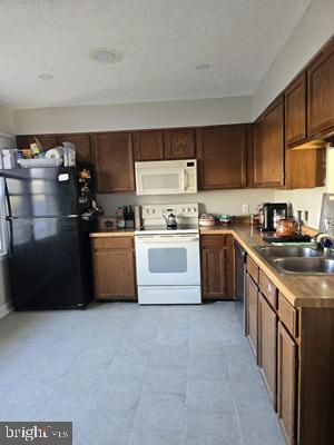 This diamond in the rough has solid bones and plenty of potential for the right buyer. The HVAC system is only two years old, the water heater is brand new, and both full bathrooms have already been updated. The home could use some fresh paint, and the dishwasher is currently not working, but the major systems are in great shape—making this an excellent opportunity for a starter home or investment.

Upstairs, you’ll find two spacious primary bedrooms, and the unfinished basement offers a blank canvas to create additional living space, a workshop, or whatever suits your needs.

This is a short sale, so patience with the process is required, but the value is absolutely there for someone ready to make it their own.