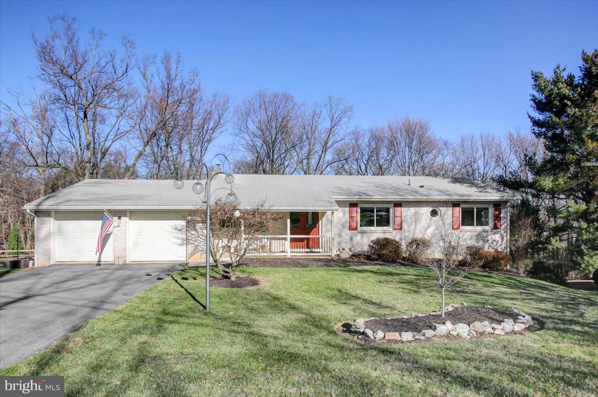 Welcome to 15 Broadmoor Dr in Upper Allen Township, Mechanicsburg Schools. This ranch style home has 3 bedrooms and 2 full baths on the main level and 1 bedroom and a full bath on the exposed lower level that walks out to the patio and heated inground pool that would be perfect as an “In Law“ suite. The private .52 acre lot backs up to the woods and pond and it feels very private and wildlife is abundant in the backyard. The sellers did a lot of updating and have remodeled the entire main level of the home including a top of the line kitchen. Kitchen appliances include G.E. Profile oven and microwave, 5 burner natural gas cooktop, Bosch dishwasher, Whirlpool refrigerator, exhaust fan. Glass, subway tile backsplash and porcelain tile floor were installed. The Kraftmaid natural cherry slab cabinets are absolutely stunning. The granite kitchen and breakfast bar countertops are nature’s work of art. They are beautiful. The kitchen, dining area and living room are all open to each other and the living room has sliders that open to the large covered deck with ceiling fan and white vinyl railing and steps to the pool deck. There is a Natural gas line for convenient grilling on the deck. This is a fantastic area for entertaining. The oak floors were sanded and refinished. Hardwood floors exist under the carpet on the main level. The hall bath has been remodeled and features a tub with 8 body jets, a rainshower head and handheld wand plus new rosewood vanity, Bluetooth fan, toilet, stone sink, lighted mirror and heated floor. The owner moved the washer and dryer up to the main level. The primary bathroom was totally remodeled with porcelain floor and tile shower and Glass door. The 3 bedrooms in the main level have new Closetmaid organizers. The house was converted to an all natural gas heating system including gas boiler, tankless water heater, gas pool heater, outdoor grill, and extra manifold for possible fireplace conversion plus new air conditioning. All windows and doors have been replaced including front double doors, 2 sliders on both levels on the back of the house. A View Rail cable rail system was installed to steps going down to the lower level. The swimming pool got a new pump, gas heater, submersible vacuum robot and white vinyl fence. The exterior was painted in 2024 and the wood deck was power washed and sealed in 2025. The lower level can be an in-law suite, the bedroom and full bath. That lower level area walks out to the concrete patio and has a family room with a wood burning fireplace. The home has a 2 car garage with remote control door openers. The covered front porch has new concrete and railing system The sellers installed a water softener. There is ample storage in the lower level or room to put in a full kitchen should the new owner want that. Much of the heavy lifting has been done to update this fantastic home. This is an opportunity to get a high end remodel at a resale price. Make no mistake, this is not a house to flip. This is high quality craftsmanship done in a modern contemporary open style by owners who cared to get the best products in their home and now you have an opportunity to enjoy this fantastic home. Do not sleep on this home or you will miss out.