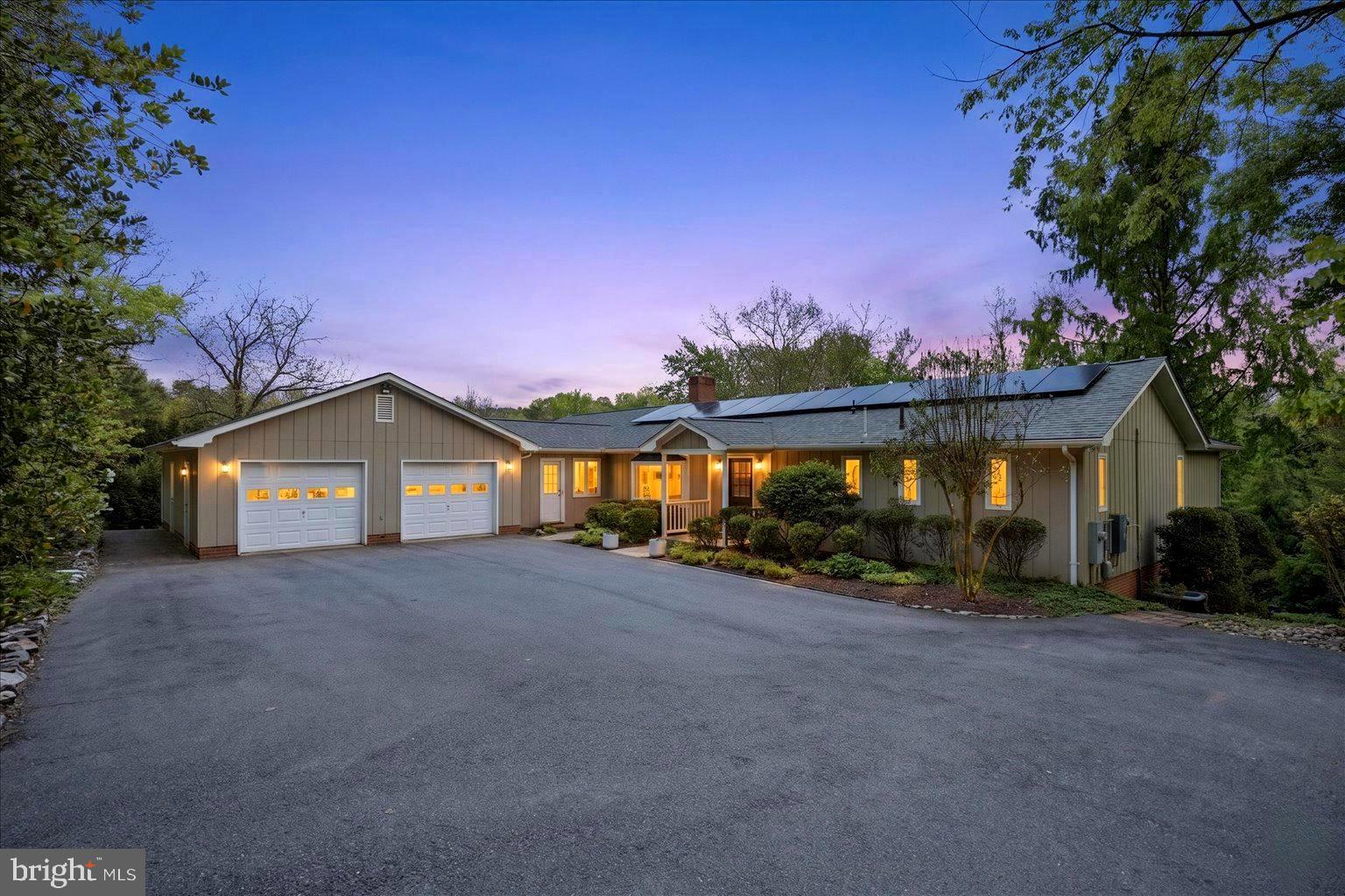 Classic waterfront home,  diligently updated and modernized with quality improvements and thoughtful design from well and septic and new floating dock on the outside, to totally renovated kitchen and primary bedroom suite  and baths on the inside.  Continue the seller's active lifestyle with the conveyance of a variety of boats and an indoor lap pool.  Enjoy the seller's efforts to  maintain this lovely home, including repaved driveway, new roof and solar panels (2023), invisible fence,), new santos mahogany floors  and so much more to appreciate in this property with a 250 foot waterfront setting.