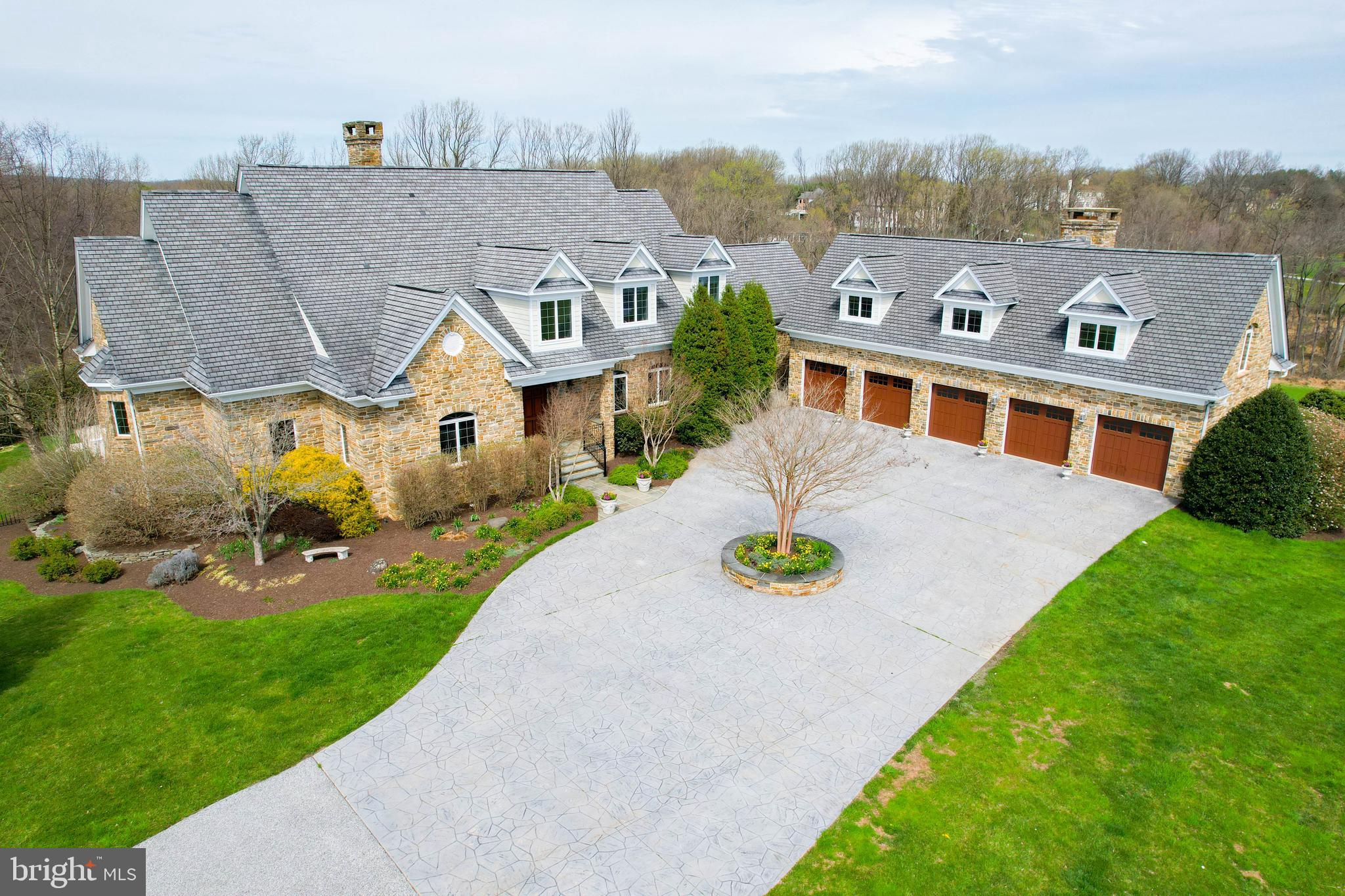 Come view this custom stone estate set amidst 40 beautiful acres with incomparable views just minutes from the Hunt Valley business district --- The 1st level consists of an open floor plan with well-proportioned rooms throughout --- A two story foyer leads to a light filled great room w/an oversized stone fireplace, a coffered 19’+ ceiling, built-ins and a wall of glass --- The dining room is improved with crown molding, chair rail and wainscoting --- The family room has a vaulted wood beamed ceiling w/skylights & an oversized fireplace that opens to the kitchen and breakfast area --- The kitchen is generous in size w/granite countertops, a center island, a walk-in pantry, cherry cabinetry & Bosch, Wolf & Sub-Zero appliances --- The 28’ primary bedroom on the main level has a sitting room w/fireplace, 2 walk-in closets & access to a bluestone terrace --- The primary bath has heated floors, a jetted tub & a separate steam shower --- A wet bar & an office are adjacent to the primary bedroom suite. A powder room, laundry rm, 2nd full bath & mudroom complete the 1st level. The 2nd & 3rd levels consists of four large bedrooms w/built-ins, three w/ ensuite baths. The lower level is fully finished w/a 20’ Rec room w/fireplace, a built-in bar area, a game room, and a theater room w/ seating for eight.  A workout space, a basketball/sport court & a powder room & full bath round out the lower level --- The main house has eight (8) Geo Thermal zones of heating and air conditioning --- The exterior has two expansive bluestone terraces and an equipment garage  --- The lower level terrace leads to a salt water heated pool with a hot tub. The property has a 5 bay garage loaded with Garage Tek built-ins --- Above the garage is a private, self-contained In-law/Au-Paire Apt – This Apt consists of a 22’ Lrm w/ fireplace open to the kitchen  – In addition there are two bedrooms w/ ensuite baths, a laundry rm and a private deck w/ scenic views --- The In-law/Au-Pair Apt has it’s own heating & CAC system --- The owners have a lease agreement with a local farmer on a year to year basis for the purpose of planting, cultivating, growing and harvesting crops (hay) on approximately 26 acres of cropland in exchange for care of the land. This arrangement significantly decreases the land maintenance that the owner needs to perform on an annual basis --- Separate Tenant House – 14025 Cuba Road --- An additional bonus is a beautifully renovated tenant house that helps to pay a large portion of the real estate property taxes. It’s comprised of a family rm, powder rm & kitchen on the 1st level + two bedrooms & one full bath on the 2nd level. The lower level has a utility room w/laundry facilities. Relax on the wraparound covered front porch and enjoy the scenic views.