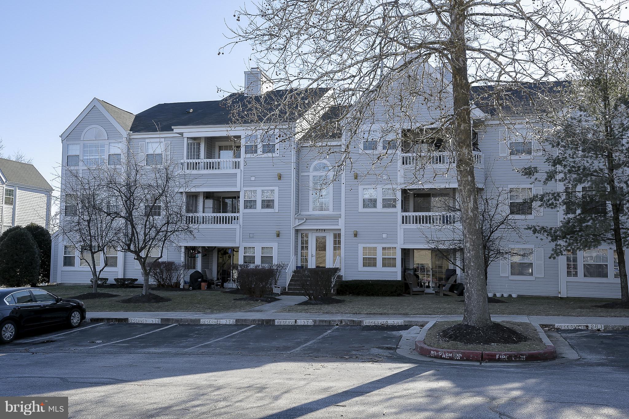 Back on the market! Buyer's gain! A lot of potential with this mid level unit with porch.    Galley kitchen with in unit washer and dryer. Replaced flooring shows very well.  Pool, clubhouse and tot lot. Maintenance free on the outside and water is included in the condo fee.