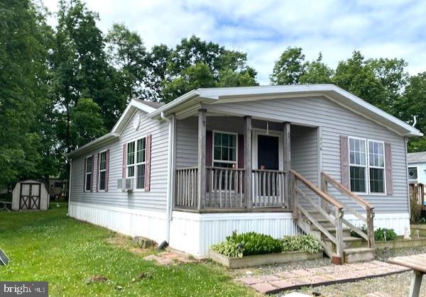 Welcome to this beautifully 2009 Marlette double-wide manufactured home located in the desirable Richland Meadows community in Quakertown, PA. Situated on a lot toward the back of the neighborhood, this move-in-ready home offers comfortable one-floor living with 2 spacious bedrooms and 2 full bathrooms. Both bedrooms feature large walk-in closets, while fresh paint and new flooring throughout create a bright, modern feel. The thoughtfully designed floor plan includes a spacious living area, a well-appointed kitchen with a center island, and a dedicated dining room perfect for everyday meals or entertaining guests. A separate laundry room includes the washer and dryer, and a convenient hallway linen closet provides additional storage. Ceiling fans in both bedrooms add comfort year-round. Enjoy relaxing outdoors on the covered front porch, and take advantage of the three-car parking area and included garden shed for all your storage needs. With low-maintenance living, this home offers exceptional value. Richland Meadows is a well-established community that provides a peaceful setting while remaining close to everything Quakertown has to offer. Residents enjoy convenient access to shopping, dining, parks, and recreational opportunities, as well as easy commuting via Routes 309, 663, and the Pennsylvania Turnpike. Quakertown's charming downtown district, community events, and nearby outdoor destinations make it a wonderful place to call home. The monthly lot rent of just $655 includes water, sewer, and trash services, adding even more affordability and convenience. Don't miss this opportunity to own a beautiful home in one of the area's most convenient locations.