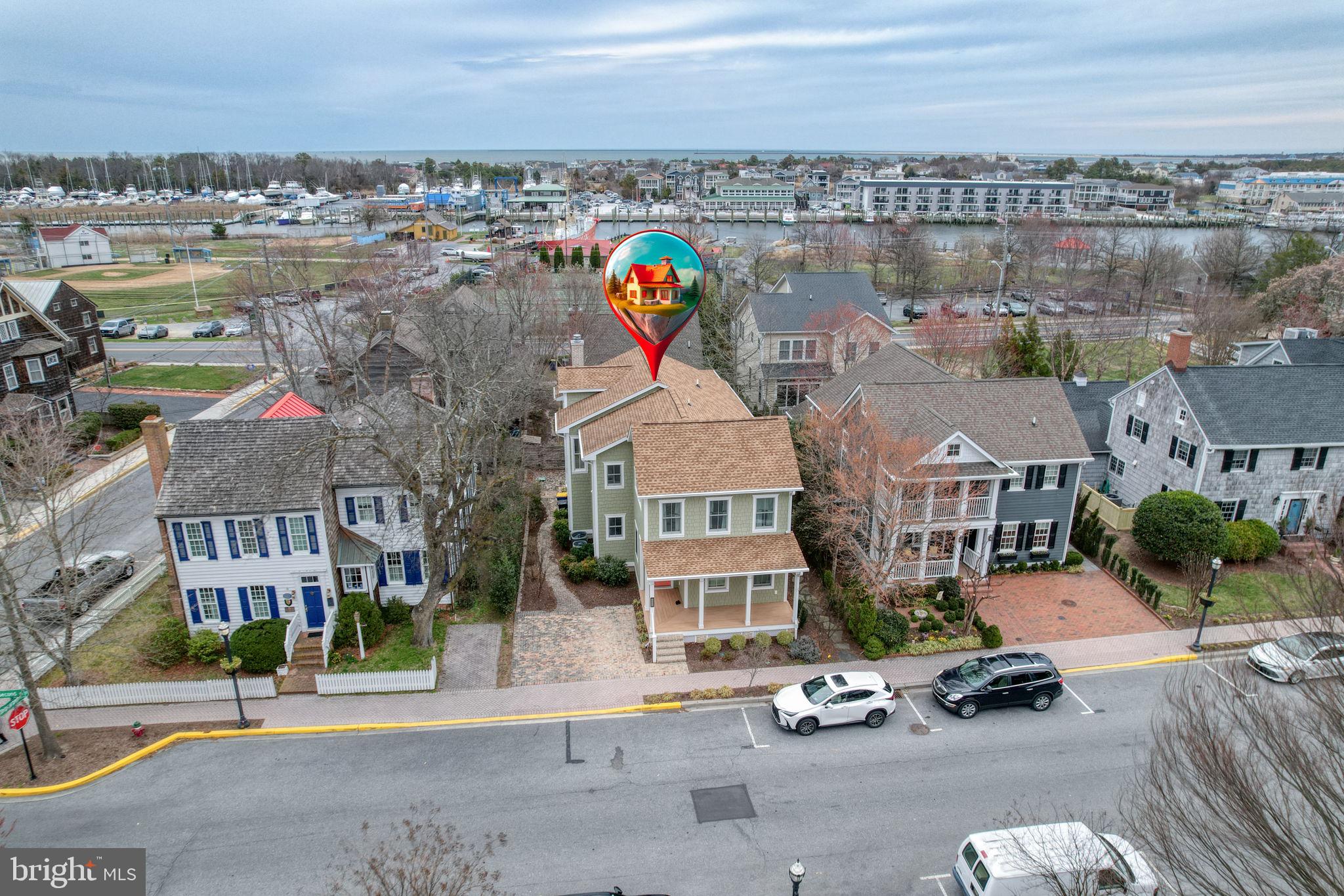 Perfectly positioned at the end of one of the most charming streets in Historic Lewes, Delaware—founded in 1631. 237 2nd Street presents a rare opportunity to own a thoughtfully designed coastal retreat. The home’s façade reflects architectural styles dating back centuries, offering the unique advantage of modern construction paired with timeless surroundings. Designed by Brenda Jones and built by respected custom builder Carl Alessi, this 4-bedroom, 3.5-bath residence seamlessly blends classic coastal character with a clean, contemporary floor plan, complete with two-car off-street parking—an invaluable amenity in this premier in-town location. Just steps from the Lewes Historical Society, Canalfront Park, and the boutique shops and restaurants along Second Street, the setting is both highly walkable and truly exceptional.

Inside, a highly desirable reverse floor plan unveils an expansive, open great room designed for effortless entertaining and everyday living. Situated on the uppermost level and accessible by elevator, this light-filled space seamlessly connects the living, dining, and kitchen areas, creating a bright, airy atmosphere rarely found within the historic district. The chef’s kitchen is beautifully appointed with leathered quartzite countertops, a custom tile backsplash, induction cooktop, and both under-cabinet and above-cabinet lighting that enhance ambiance and functionality. A large pantry and generous workspace further elevate the experience. Wide plank LVP flooring flows throughout, complemented by a gas fireplace, whole-home music system, dual fuel heating, and an alarm system. Both first- and second-floor primary suites provide flexible living arrangements, while custom closets, a dedicated utility room, and exceptional storage reflect the home’s thoughtful design.

A relaxing three-season EZ Breeze sunporch offers the perfect setting to unwind or entertain in comfort. From your doorstep, enjoy easy access to scenic bike trails connecting to Cape Henlopen State Park and Rehoboth Beach, or spend your days along the shores of Lewes Beach. Offering the rare combination of historic district charm and modern, open-concept living, this meticulously crafted home delivers an exceptional coastal lifestyle defined by convenience, character, and timeless appeal.