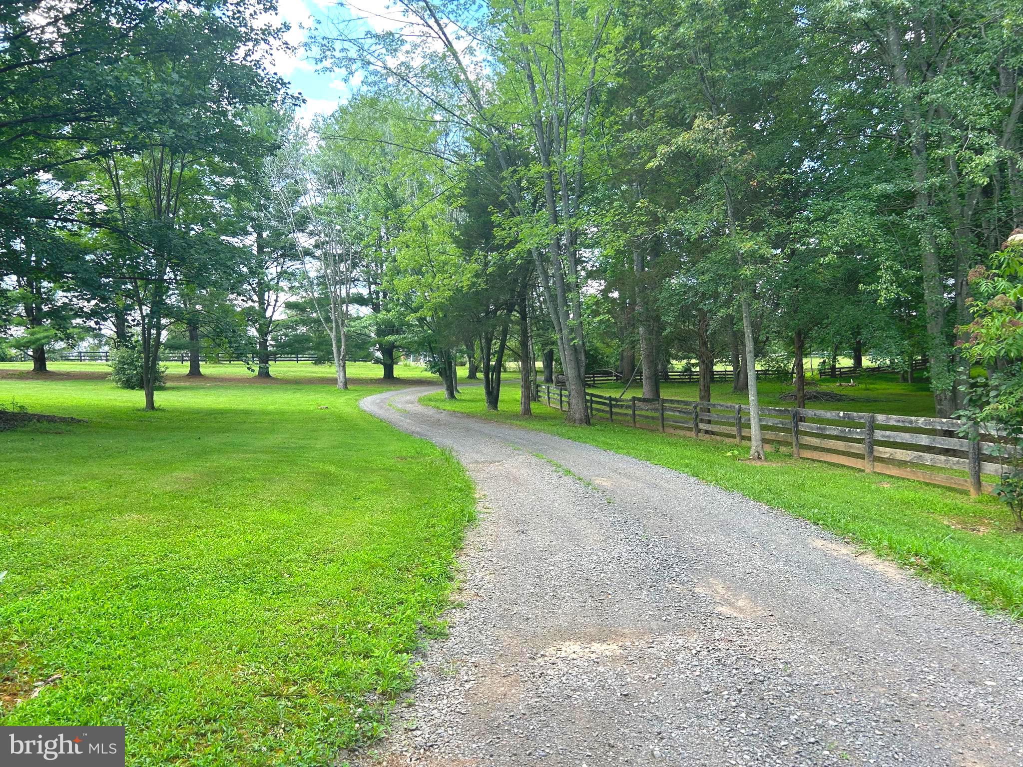 As-Is Sale. If you're looking for privacy, acreage, and the chance to make a home your own, this 10-acre property is worth a look. The beautiful private pond is perfect for fishing, canoeing, seasonal ice skating, or simply relaxing and enjoying the peaceful setting. There's also plenty of room for farm animals—buyers should check with Culpeper County for permitted uses.  The home offers 4 bedrooms, 2.5 bathrooms, a large Great Room with a wood-burning fireplace, a Formal Living Room with its own wood-burning fireplace, a Formal Dining Room, and hardwood floors throughout the main and upper levels. The partially finished basement provides additional space for storage, hobbies, or future finishing.  Outside you'll find a workshop area with a private fuel pumping station, making it ideal for equipment, tractors, or farm use.  This home has great bones but does need repairs and updating. It is being sold strictly As-Is and is priced to reflect the work needed. If you've been searching for a property with land, privacy, and the opportunity to build equity, this could be the one.