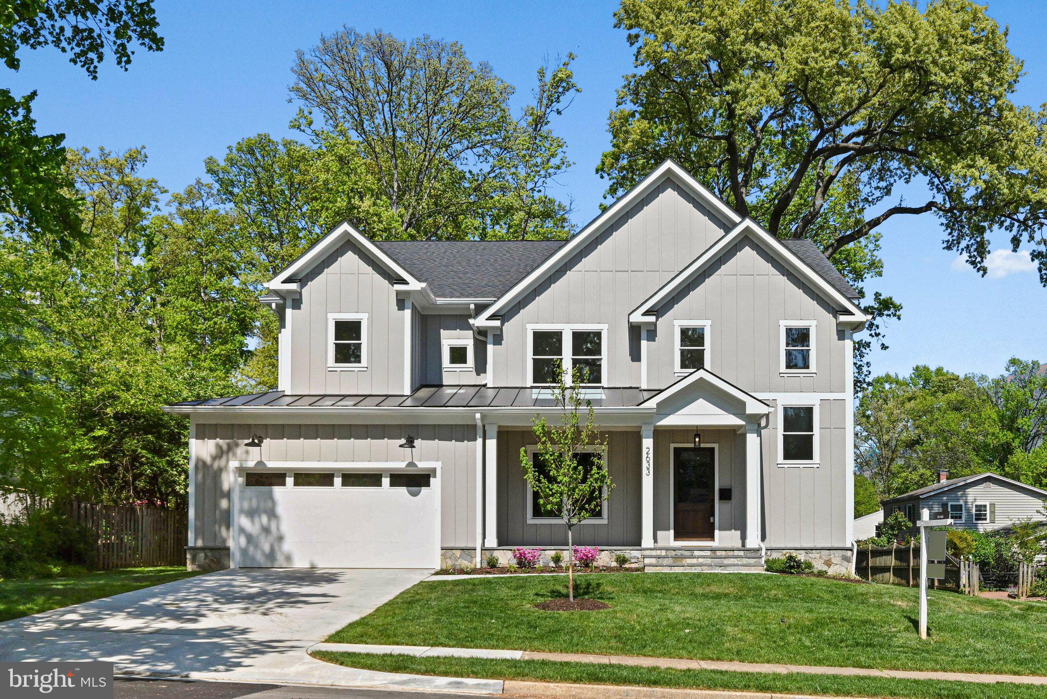 Wooster Ct is the new standard in living for Dunn Loring Woods.  In a neighborhood known for its established charm, this new construction by Dunhill Builders, emerges as a breath of fresh air with this true architectural statement.  This newly designed home is perfect for todays modern living, maximizing open space with functionality.  Situated on a sprawling .29 acre lot, this residence transcends the typical "new build" by blending massive scale (over 6,000 square feet) with the intricate, warm finishes usually reserved for custom homes.  The curb appeal is immediate and intentional. From the elegant stone water table to the Hardie plank siding, the exterior signals quality. The deep front porch, finished with a rich wood ceiling and classic trimmed columns, offers a sophisticated transition from the quiet street to the grand interior. Inside,10 foot ceilings and premium Marvin windows flood the main level with natural light, highlighting the organic texture of wide plank white oak floors.  The kitchen is the heart of the house, featuring a massive quartz island and luxury appliances and ample cabinetry. The addition of a butler’s pantry with a wine refrigerator allows for a modern entertaining style that balances high-end hosting with everyday comfort.  The family room, anchored by a minimalist gas fireplace, provides a soaring yet cozy space for everyday connection and is open to the kitchen.  ***The Main level also has an alternative option to add a first floor bedroom.***  The lower level which offers a massive recreation space with a wet bar rough in, a dedicated home gym, and a fifth en suite bedroom is open and bright with plenty of space for entertaining large gatherings. Dunn Loring Woods offers the ideal location situated perfectly between the charm of old town Vienna and the hustle and bustle of Tysons Corner.  Metro Access, world class shopping, and dining are practically at your doorstep. Whether joining for a private tour or an open house, this is a must see when searching in Vienna.