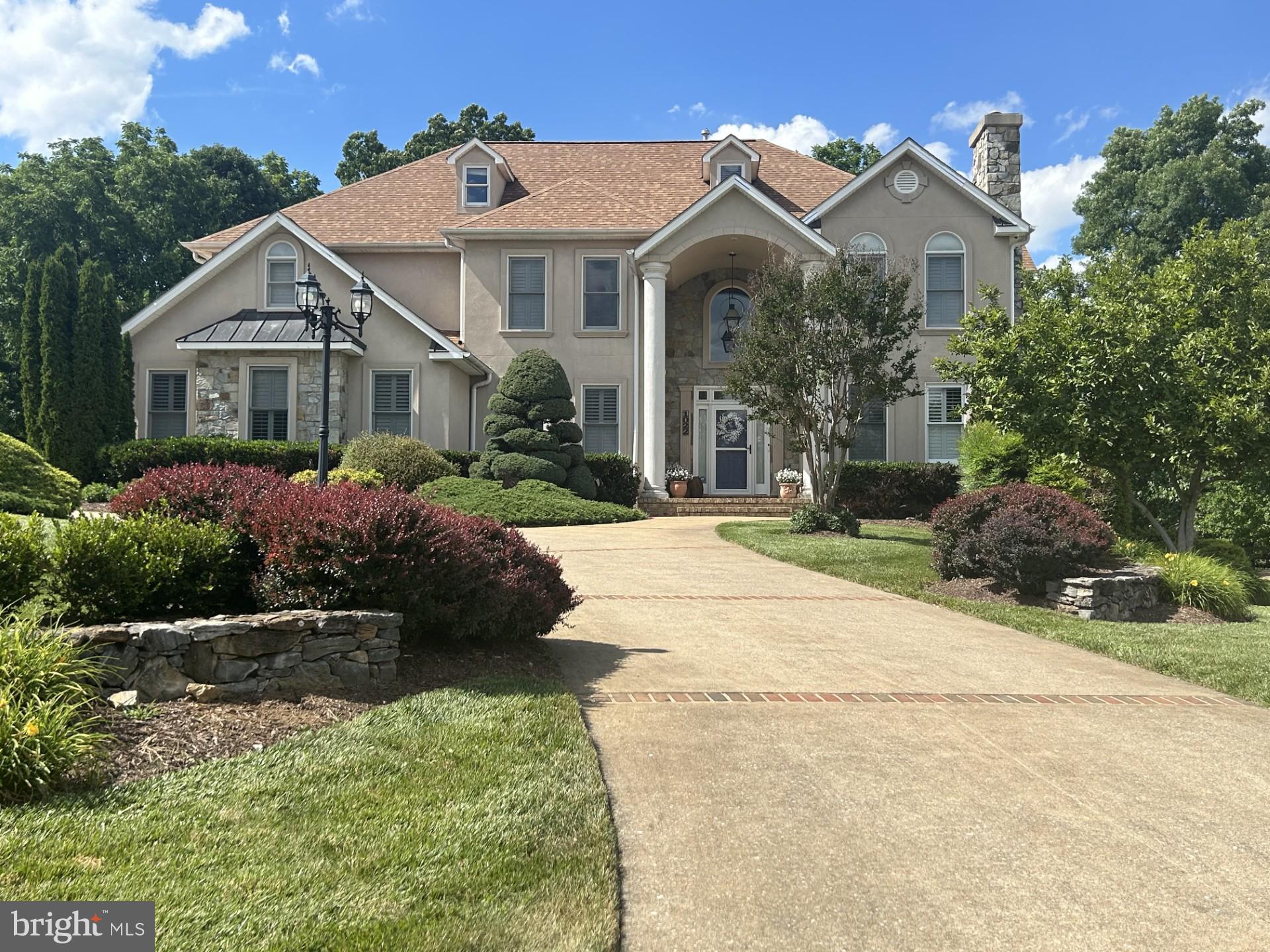 This amazing property is ready for you!    Located close to Winchester Medical Center, Churches, Shopping, Historic Downtown Winchester, John Kerr Elementary School, and John Handley High School.  This property is beautifully landscaped with plush gardens, a koi pond, waterfalls, a large pool, pool room, large deck overlooking the property, and a fenced backyard lined with mature trees for privacy.  Inside, you will find a stunning kitchen with top-of-the-line appliances and pull-out drawers throughout the cabinets.  The great room is a 2 story ceiling and fireplace leading to the deck and wet bar with ice machine and wine racks.  The main level office has a full bath attached if you would like to use it as a main level bedroom.  The living and dining rooms are open to each other leading to a sunroom off the deck.  The primary bedroom as a gas fireplace, a balcony , 2 walk in closets and an updated spa like bathroom.  The second bedroom has it's own bath and the 3rd and 4th bedrooms share a full bath with updated tile and floors.  The basement also has a fireplace, a full bath, exercise room and plenty of storage.  The pool room (in the basement leading to the pool) has a refrigerator, storage for towels and a 1/2 bath. The 3 car garage has a ton of storage, as the original kitchen cabinets are on the wall...This home is truly a showcase!