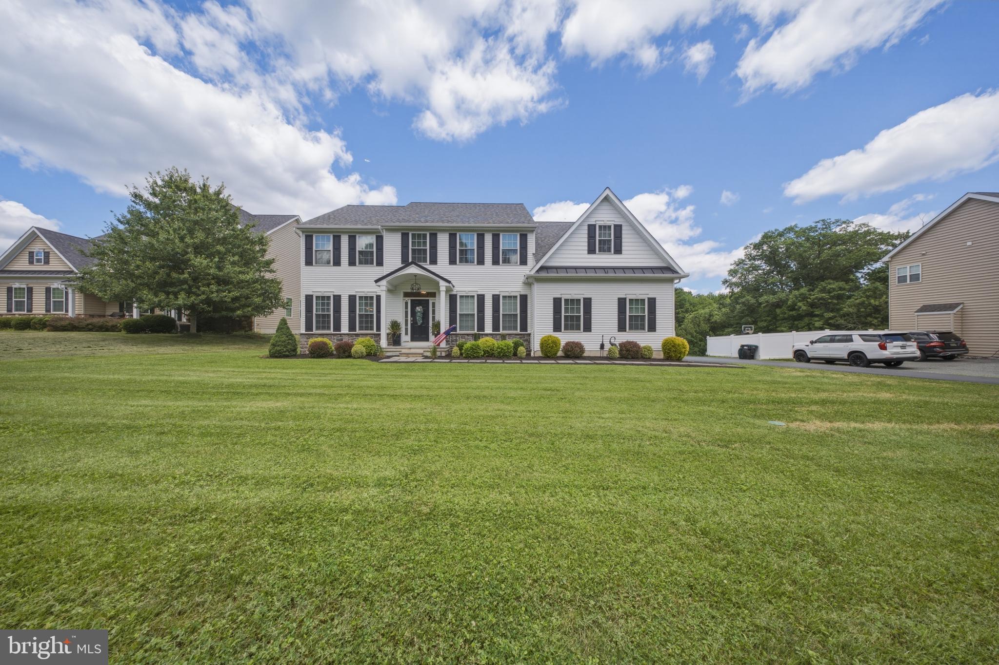 This beautifully upgraded 3-year young home offers timeless curb appeal with a stone front & welcoming front porch. Enter from the front door into your grand 2-story foyer with an open stairwell & thoughtfully designed open floor plan. French doors lead to a private office/bar room/play room. Next you will find the spacious dining room with chair rail, crown molding & plenty of natural lighting. The gourmet kitchen features 42” white cabinetry, tile backsplash, farmhouse sink, upgraded gas range, large island with seating, and spacious pantry. The soaring family room boasts a 2 story, vaulted ceiling, gas fireplace with custom floor-to-ceiling surround, and abundant natural light. Eat in kitchen boasts sliding glass doors to the back yard oasis with a stamped concrete patio, gazebo with fire pit, in ground swimming pool with sun ledge & another gazebo for a fun bar area. Back inside and upstairs you will find the luxurious primary suite offers a vaulted ceiling, walk-in closet, and spa-like bath with double vanity, stunning tiled shower, private toilet room, and linen closet. Enjoy the convenience of second-floor laundry with cabinets, a wash tub & plenty of space! Beautiful hall bathroom with double sinks, tile flooring, tub with tile surround, hall linen closet. 3 very generously sized bedrooms all with ample closet space & one offers a bonus room/dressing room.  Huge unfinished basement ready for your finishing touches- basement offers an egress window. Additional highlights include a widened driveway, transferable 10-year home warranty, epoxy garage floor w/ electric door openers, and low taxes!