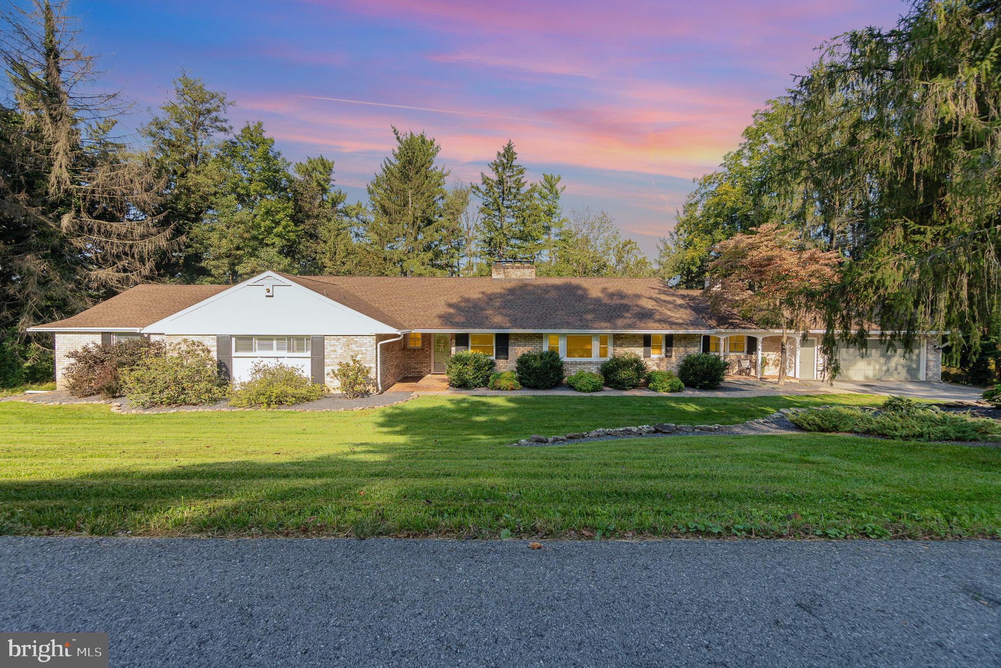 Due to an extremely unfortunate situation with the previous buyer, your dream home is back on the market!!  This meticulously updated rancher has everything that you've been looking for and more. The large living room has a wood burning fireplace with surround book cases and hardwood floors.  Get ready for the chef's dream kitchen with quartz counter tops, large eat-at island, gas cooking, double wall oven...and don't forget to check out the butler's pantry sitting off the living room behind one of the barn doors.  Big formal dining has built-in to hold all of your special dishes, a wood burning fireplace, and a big window that overlooks the back yard.  The owner's suite has double closets and a bathroom with double sinks, heat lamp, soaking tub, and stall shower with rainfall faucet.  2 more bedrooms on this level, both offer a shiplap accent wall and one features a built-in desk and bookcase.  Continue to the end of the hallway and enter the Family Room/ Library, a room that will be sure to impress anyone!  The lower level has a 2nd family room with wood fireplace, the 4th bedroom, and another full bath making this a possible in-law or guest quarters.  Off the dining room is an amazing Sun room with brick floor which leads to the massive deck with several seating areas.  The deck is surrounded by beautiful landscaping.  The stairs lead down the firepit area and tree lined back yard.  This beauty, with 2 car attached garage won't last long; and with inspections already being done stop thinking about your dream home, and get ready to spend the new year in it!
