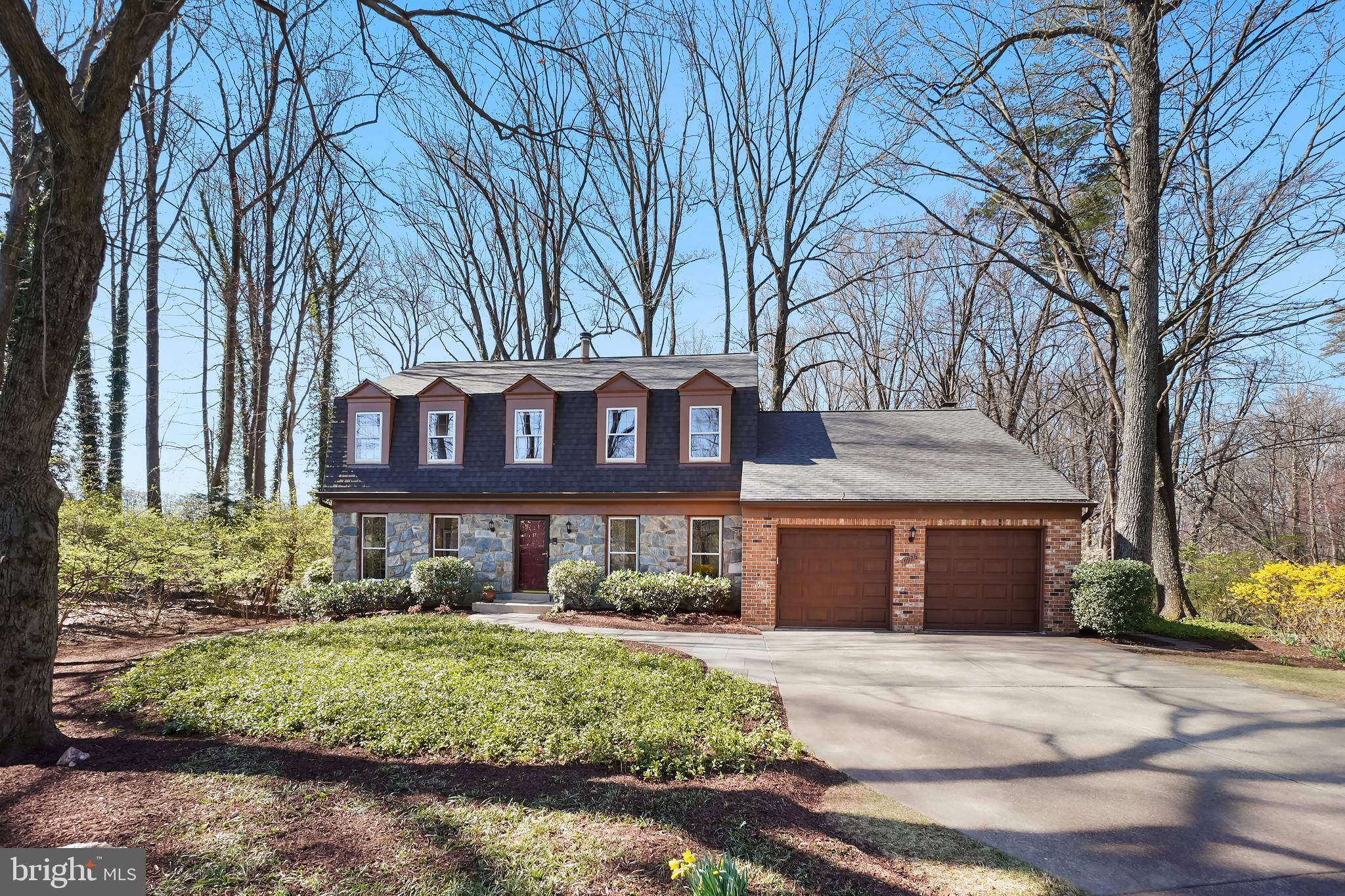 Major Price Improvement! Nestled on a tranquil, tree-lined street in the highly sought-after Stratton Commons neighborhood, this beautifully maintained 4-bedroom, 3.5-bathroom colonial boasts over 3,802 square feet of refined living space. From the moment you arrive, you’ll be captivated by its charming curb appeal and private location featuring a stunning stone and brick elevation, lush landscaping, and a sprawling half-acre lot.

Step inside to discover a sun-drenched living room with elegant French doors, a formal dining room, and a dedicated study—perfect for a home office. The chef’s kitchen is a standout, featuring custom hand-crafted maple cabinetry, gleaming granite countertops, and stainless-steel appliances. Adjacent to the kitchen, the breakfast room opens to a spacious deck and patio, seamlessly blending indoor and outdoor living. The inviting family room, with a wall of glass doors, leads to an expansive screened-in porch—an idyllic retreat for your morning coffee or evening glass of wine. A renovated powder room and dedicated laundry room complete the main level.

Upstairs, the primary suite is a true sanctuary, offering a private sitting area, a luxurious marble spa-like bathroom, with a spacious shower and heated towel rack. Three additional generously sized bedrooms share an updated hall bath, showcasing a stunning Taj Mahal quartzite vanity and custom tile.

The fully finished lower level provides incredible versatility with a large open space, a full bath, and a generous storage/utility area—ready to be customized to suit your needs.
Recent Upgrades & Features include:
New Roof (2024)
New Garage Doors (2021)
Professionally Landscaped (2019)
New Water Heater (2021)
Full Home Insulation Upgrade (2019)
Kitchen (2009) & 3 Bath Renovations (2017)
HVAC Service Contract to convey to new Buyers - through Dec. 2025

Enjoy the best of Bethesda living with easy access to I-495, I-270, Metro, NIH, upscale dining, boutique shopping, and the renowned Strathmore concert hall—celebrated for its pitch-perfect acoustics.
This exquisite home is a rare find—don’t miss your chance to make it yours!