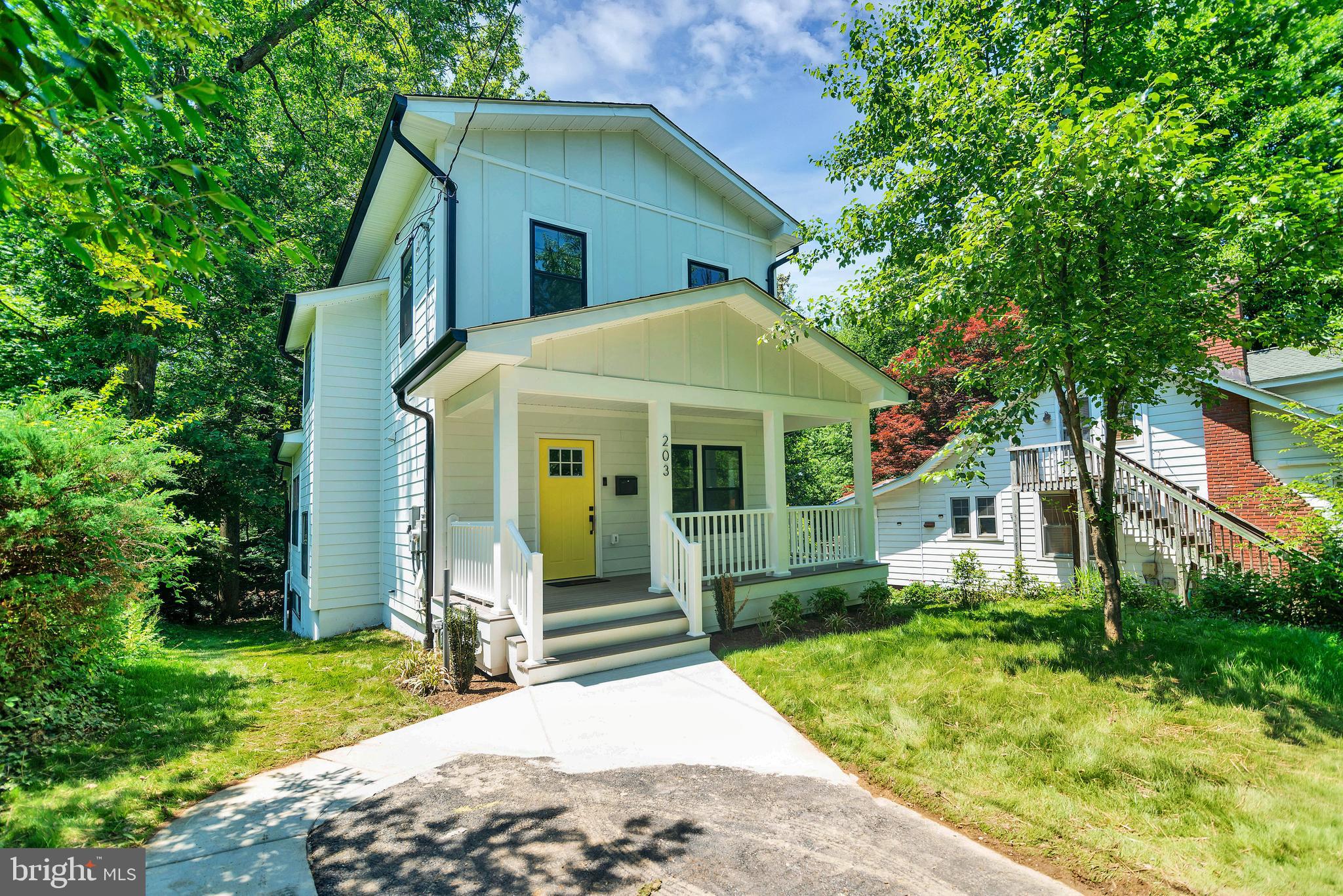 Thoughtful design, flexible living space, and income potential come together beautifully in this newly built 5-bedroom, 3.5-bath home in the heart of Takoma Park. Spanning three fully finished levels, this home offers a rare blend of contemporary finishes, functional layout, and ADU-ready versatility. A welcoming covered front porch sets the tone before stepping inside to a sun-filled front living room, soaring ceilings, warm maple hardwood floors, and an open-concept main level built for entertaining and everyday living. Conveniently located just off the front living room is a stylishly appointed half bath for guests. The chef’s kitchen anchors the space with quartz countertops, stunning charcoal cabinetry, brushed gold accents, custom glass backsplash, and seamless flow into the dining area with cozy built-in bench seating. The family room features in-ceiling Bluetooth audio and opens to a covered rear deck overlooking an actual neighborhood park, creating a peaceful green backdrop. Upstairs, the spacious primary suite includes in-ceiling audio, two generous closets including a walk-in, and a spa-inspired bath with double vanity and glass-enclosed shower. Two additional well-proportioned bedrooms, a full bath, and convenient laundry closet complete the upper level. The fully finished ADU-ready walkout basement offers exceptional flexibility with 2 legal bedrooms, full bath, wet bar that can easily expand to kitchenette, washer/dryer hookup, separate mini-split HVAC system for independent comfort and future ADU flexibility, abundant natural light, and private exterior access — ideal for multigenerational living, extended guests, au pair quarters, or future rental income potential. Nest thermostat and USB outlets throughout complete this thoughtfully designed home.