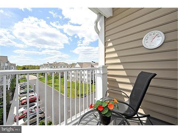 Discover exceptional living at The Reserve at Gwynedd, a gated widely regarded, premier active-adult community.  This beautifully maintained 2-bedroom, 2 bath condominium offers a wonderful life-style combination of comfort, privacy, and outstanding value.  You will feel the elegance as you enter this bright, light, top floor condo.  Hardwood floors throughout the Living Room, Dining Room, and Kitchen are pristine.  An eat-in kitchen with 42" beautiful light wood cabinets and stainless steel appliances flows into a spectacular octangular Dining Room with exceptional mill work and tray ceiling flowing into a lovely Living Room. Double sliding doors with Hunter Douglas window treatment lead to a balcony with a bright open view. In addition to the large master bedroom suite and walk-in-closet the second/office with double closet and oversized second full bathroom, extra large separate laundry room  with sink and several additional closets and storage. The deeded underground garage space and locker are well positioned near the elevator. Community facilities include Full Time Activities Director, Indoor and Outdoor pools, hot tub,saunas,Gym, Card rooms, Ballroom, Library, Living Room with Fireplace, Billiards room; and organized activities such as Card games, water Aerobics, Exercise classes, ping pong, lectures, trips, and parties throughout the year. Make your appointment now and request a tour of the clubhouse to get the Full Experience that the Reserve at Gwynedd offers.